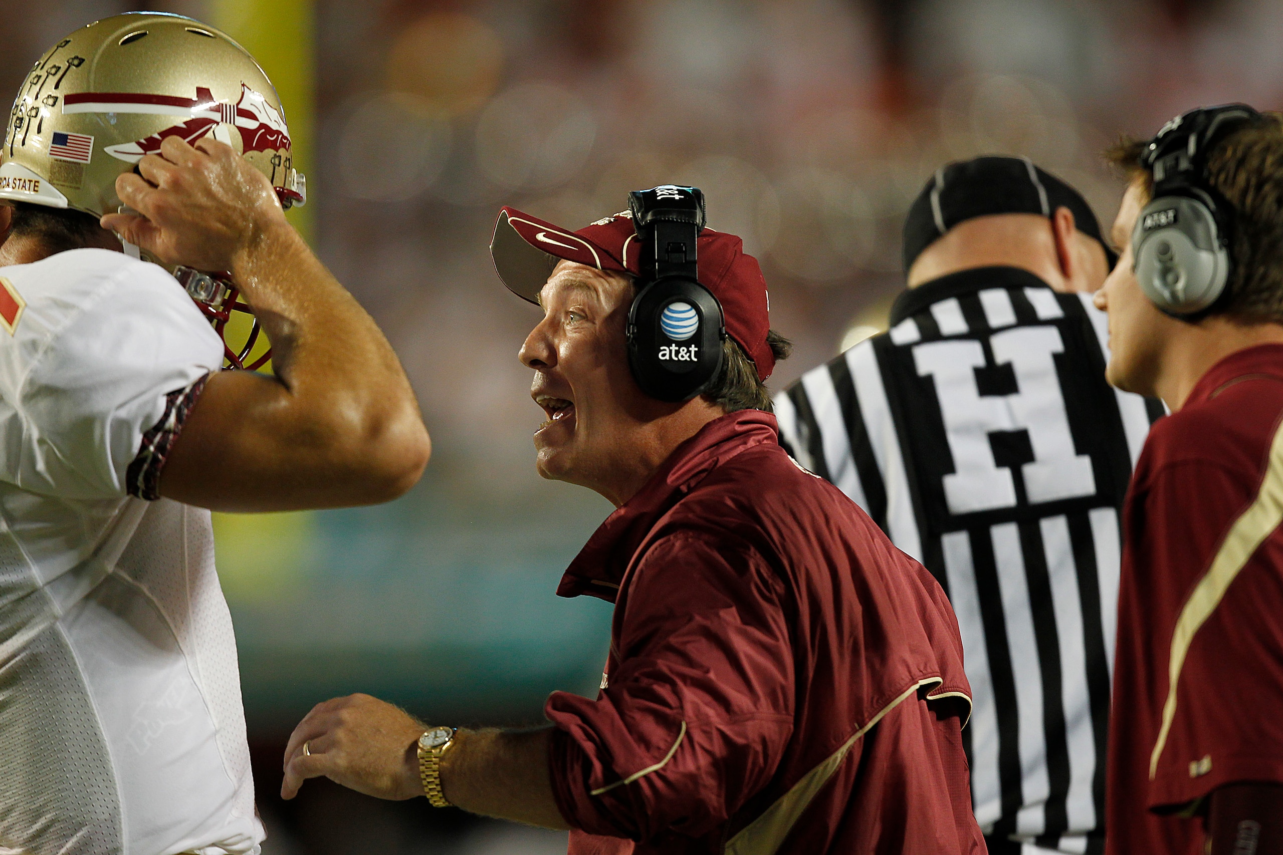 MIAMI, FL - OCTOBER 9: Head coach Jimbo Fisher talks to Christian Ponder #7 of the Florida State Seminoles during first half action against the Miami Hurricanes on October 9, 2010 at Sun Life Stadium in Miami, Florida. (Photo by Joel Auerbach/Getty Images