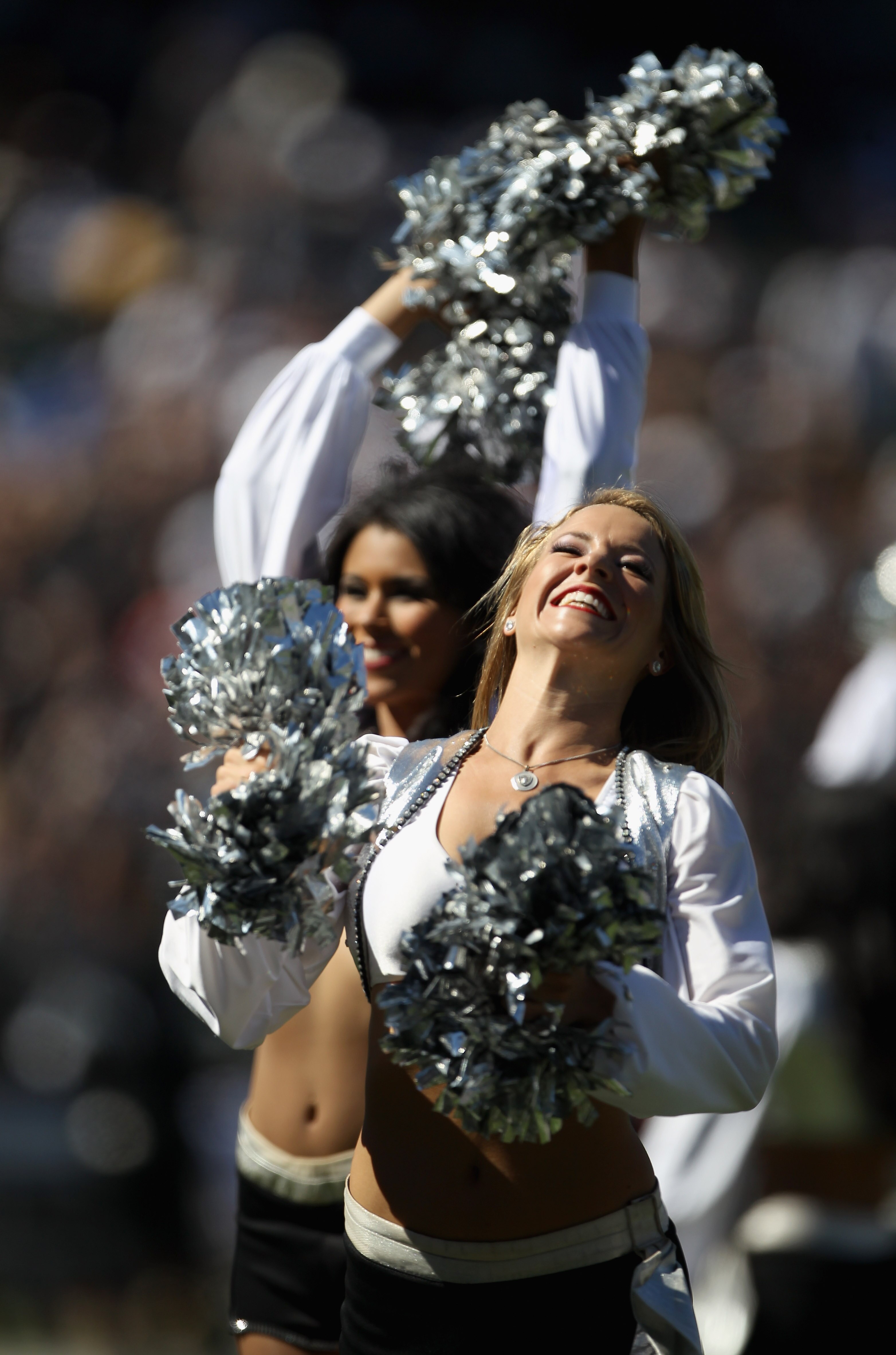 OAKLAND, CA - OCTOBER 10:  Oakland Raiders cheerleaders, the Raiderettes, cheer for their team during their game against the San Diego Chargers at Oakland-Alameda County Coliseum on October 10, 2010 in Oakland, California.  (Photo by Ezra Shaw/Getty Image