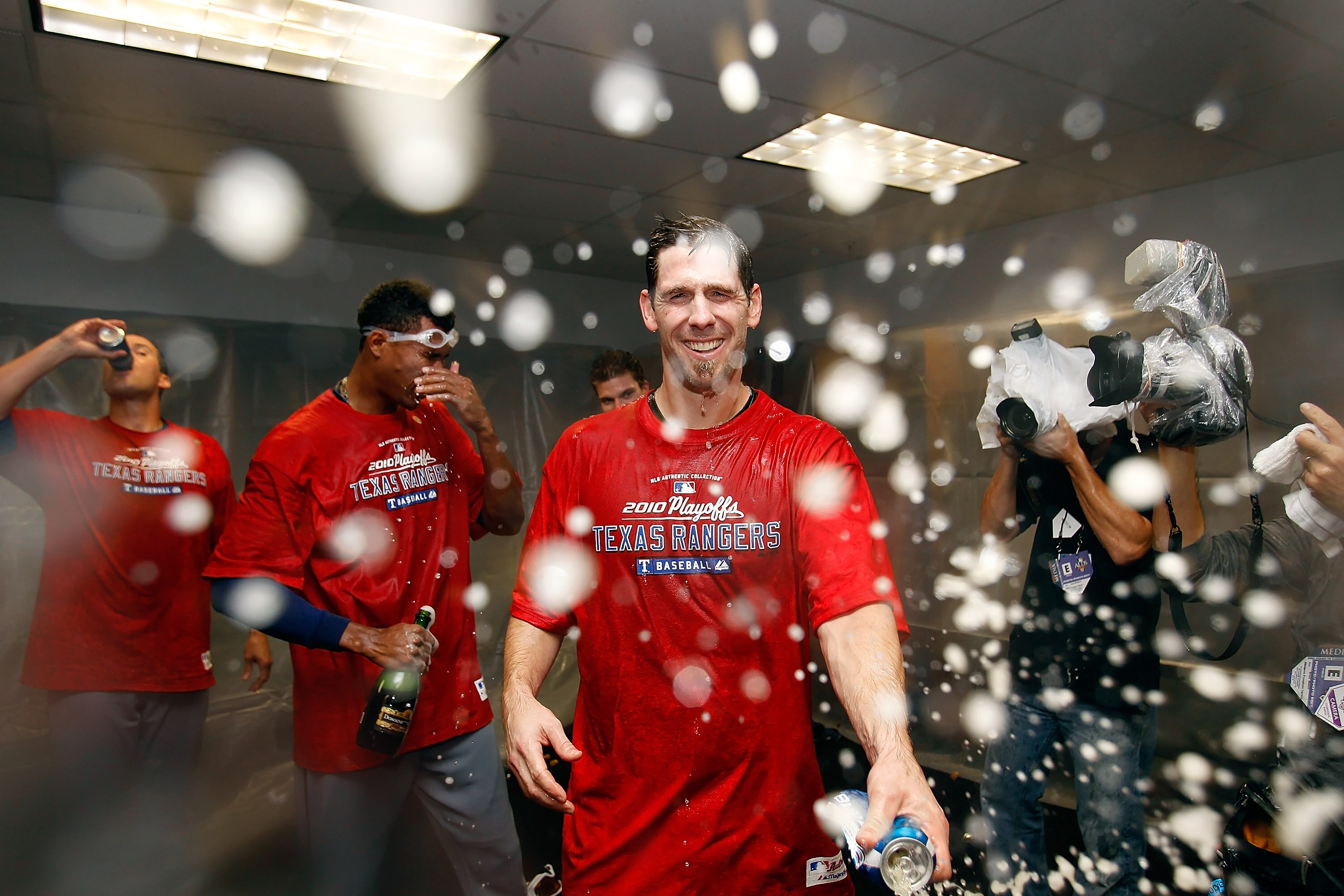 ST PETERSBURG, FL - OCTOBER 12:  :  Pitcher Cliff Lee #33 of the Texas Rangers celebrates his team's victory over the Tampa Bay Rays in Game 5 of the ALDS at Tropicana Field on October 12, 2010 in St. Petersburg, Florida.  (Photo by J. Meric/Getty Images)