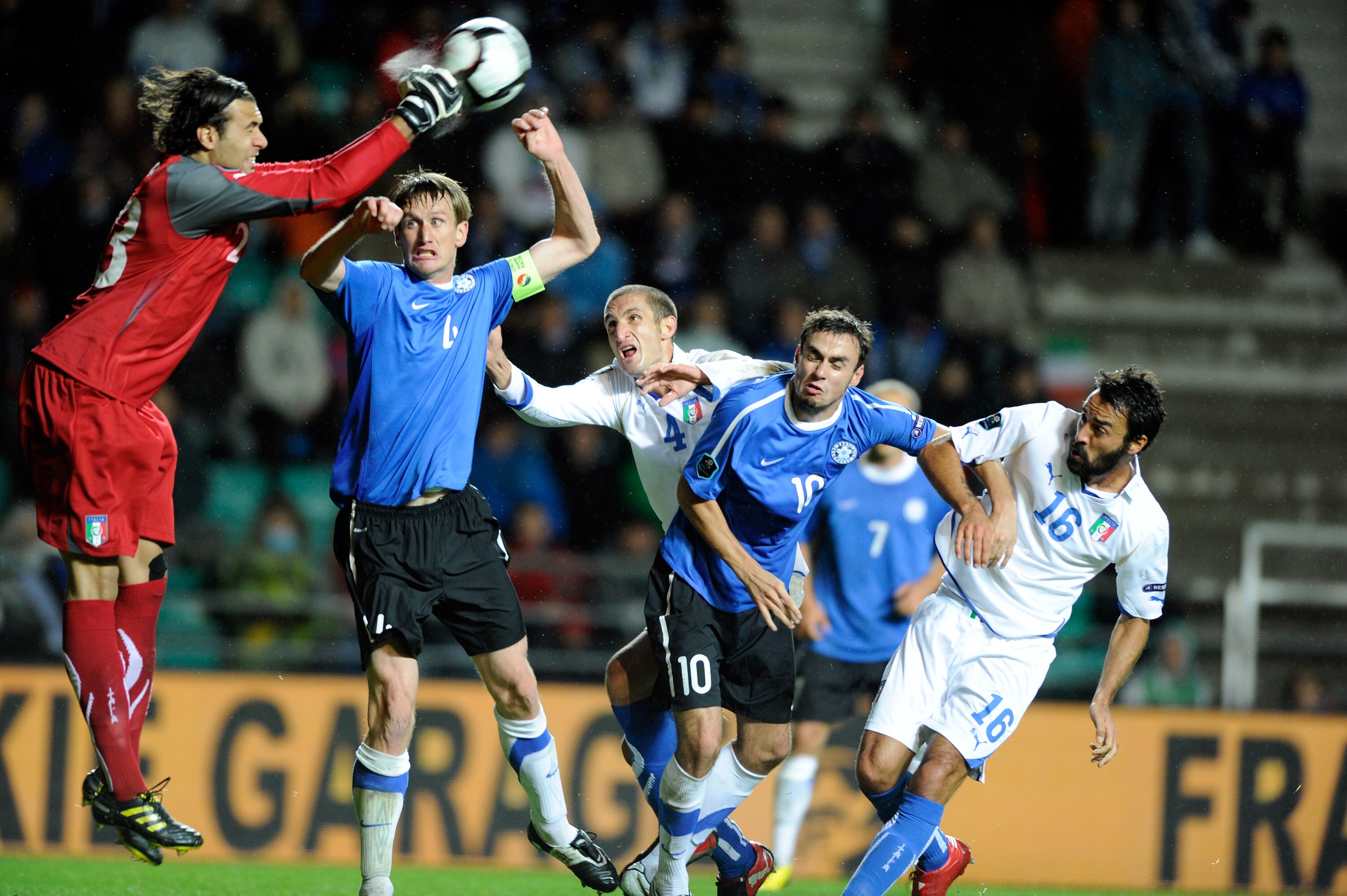 TALLINN, ESTONIA - SEPTEMBER 03:  Salvatore Sirigu of Italy vies for the ball with Aleksandr Dmitrijev of Estonia during the Euro 2012 qualifying match between Estonia and Italy, at Le Coq Arena on September 3, 2010 in Tallinn, Estonia.  (Photo by Claudio