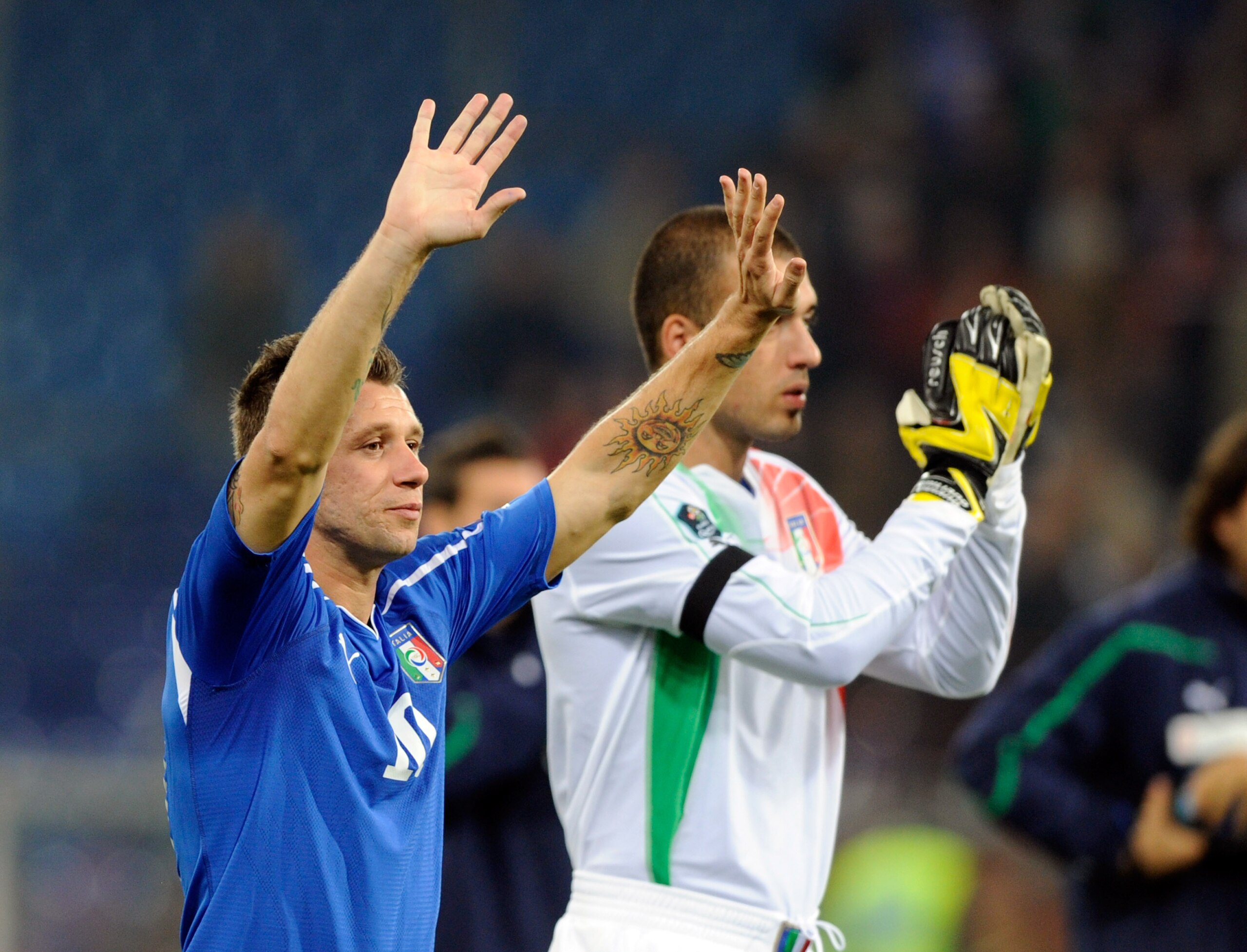 GENOA, ITALY - OCTOBER 12:  Antonio Cassano and Emiliano Viviano of Italy applaud the Italian fans during the UEFA EURO 2012 Group C qualifier  between Italy and Serbia at Luigi Ferraris Stadium on October 12, 2010 in Genoa, Italy.  (Photo by Claudio Vill