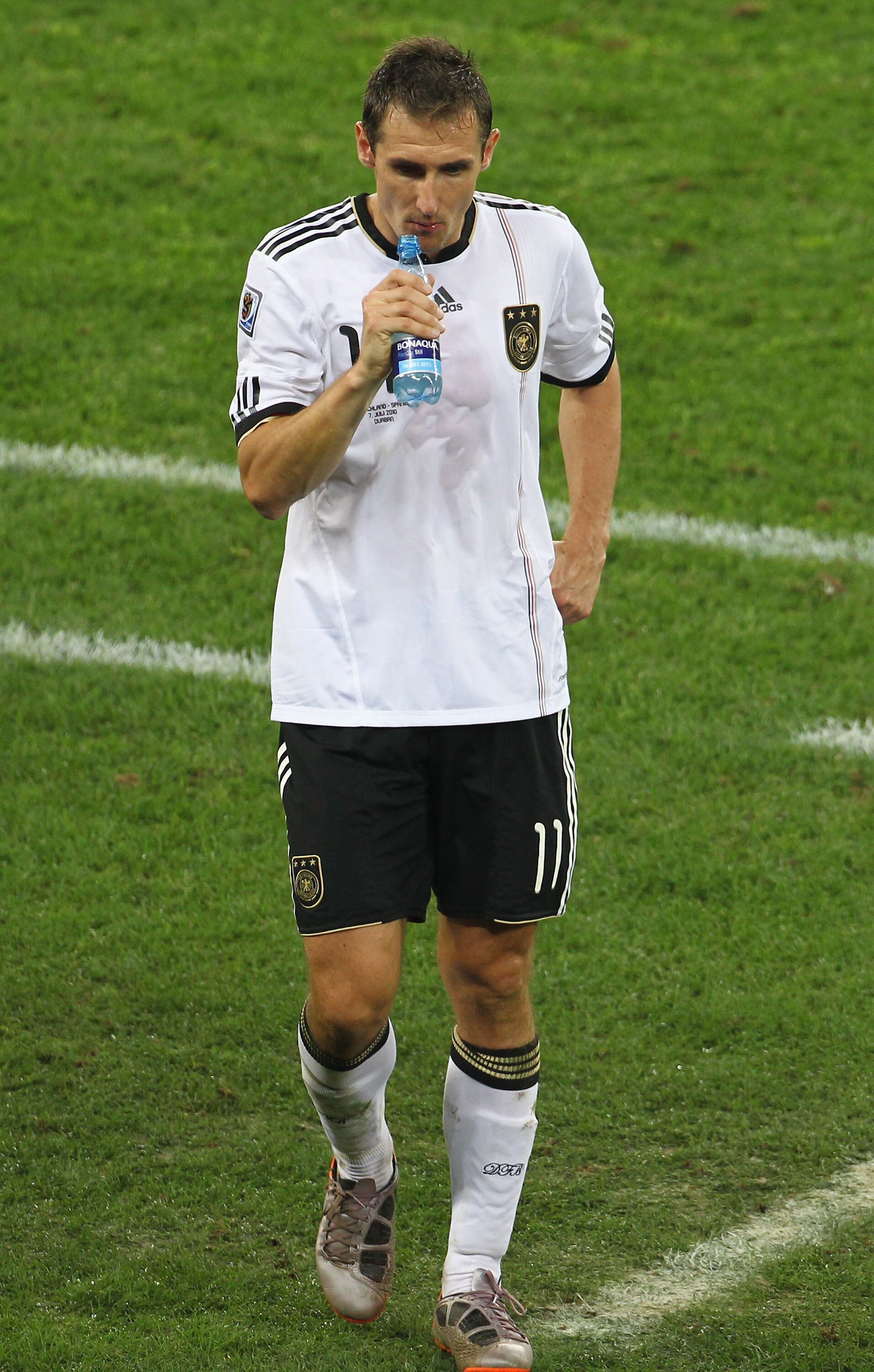 DURBAN, SOUTH AFRICA - JULY 07:  Miroslav Klose of Germany leaves the field dejected after being knocked out of the competition following the 2010 FIFA World Cup South Africa Semi Final match between Germany and Spain at Durban Stadium on July 7, 2010 in