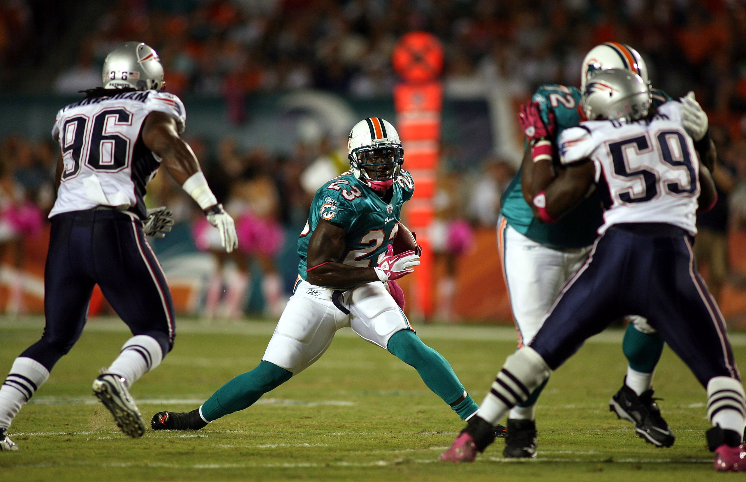 MIAMI - OCTOBER 04:  Running back Ronnie Brown #23 of the Miami Dolphins runs against the New England Patriots at Sun Life Stadium on October 4, 2010 in Miami, Florida.  (Photo by Marc Serota/Getty Images)