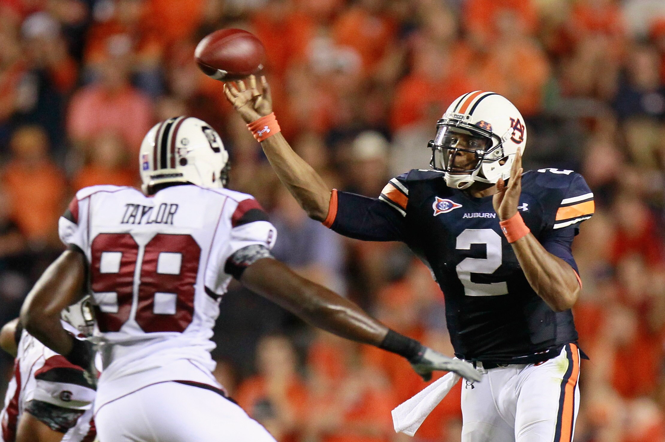 AUBURN, AL - SEPTEMBER 25:  Quarterback Cameron Newton #2 of the Auburn Tigers passes the ball in front of Devin Taylor #98 of the South Carolina Gamecocks at Jordan-Hare Stadium on September 25, 2010 in Auburn, Alabama.  (Photo by Kevin C. Cox/Getty Imag
