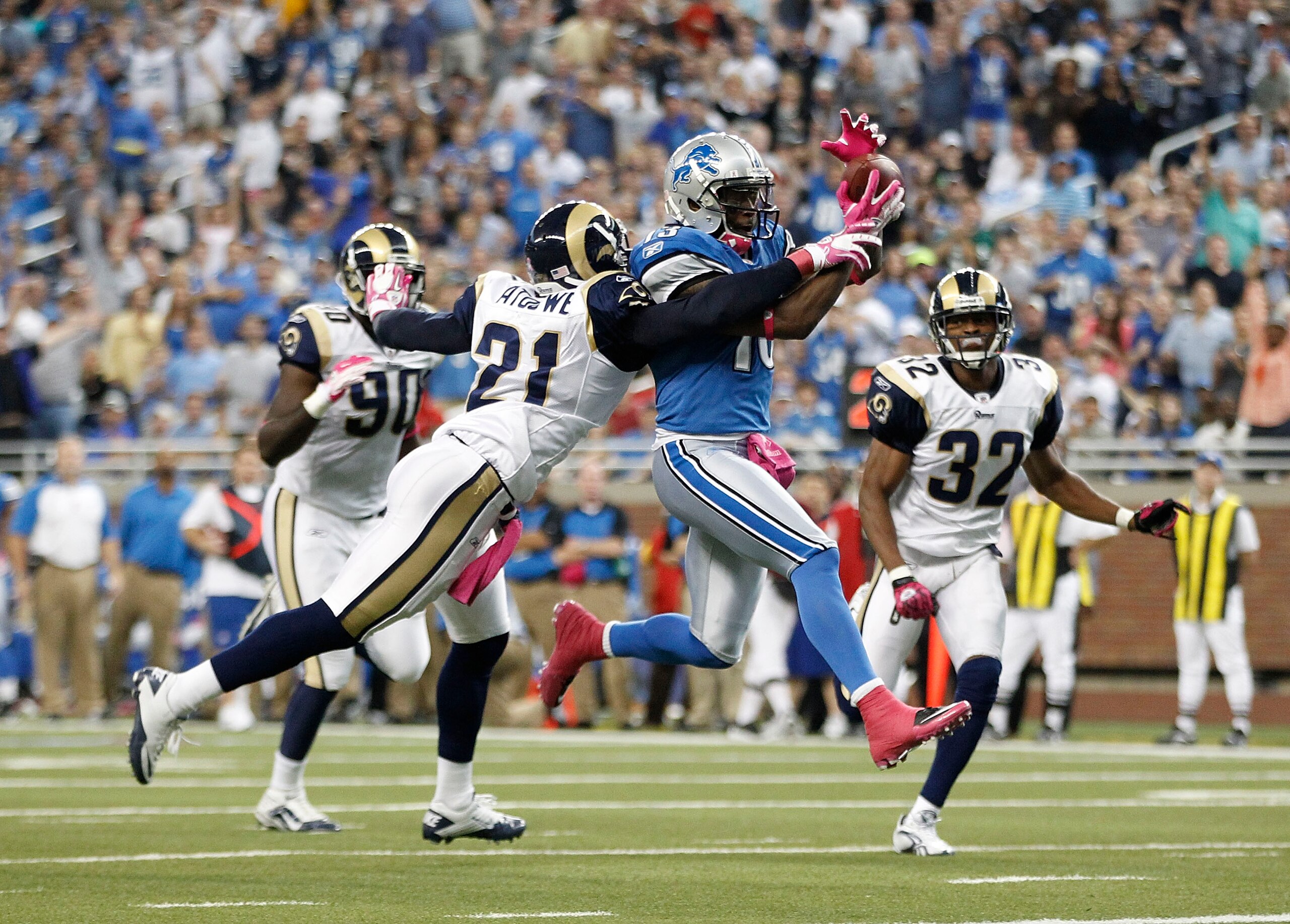 DETROIT - OCTOBER 10: Nate Burleson #13 of the Detroit Lions scores a third quarter touchdown on a 21 yard pass from Shaun Hill #14 during the third quarter of the game against the St. Louis Rams during the second quarter of the game at Ford Field on Octo