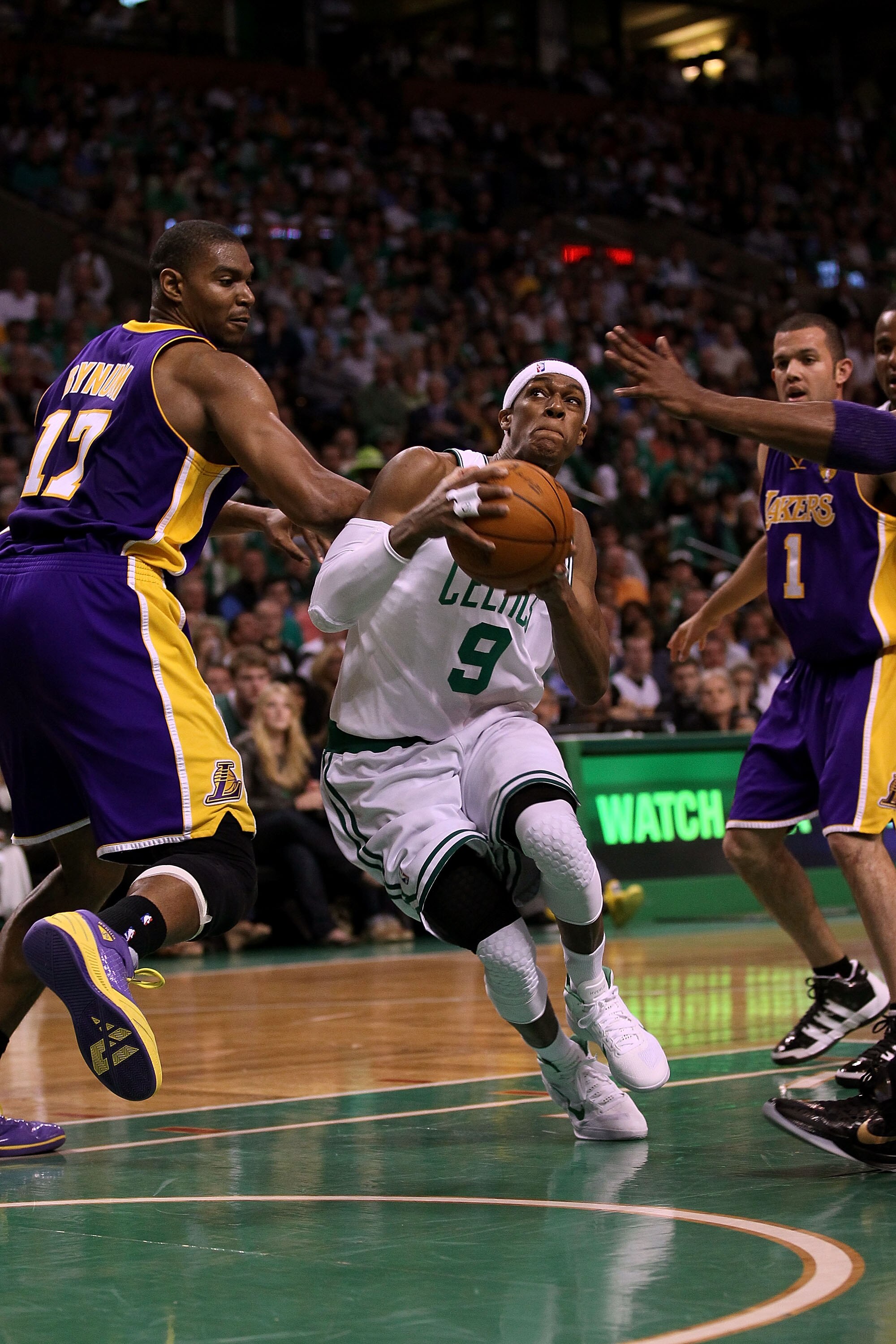 BOSTON - JUNE 13:  Rajon Rondo #9 of the Boston Celtics drives to the basket against Andrew Bynum #17 of the Los Angeles Lakers in the second quarter during Game Five of the 2010 NBA Finals on June 13, 2010 at TD Garden in Boston, Massachusetts. NOTE TO U