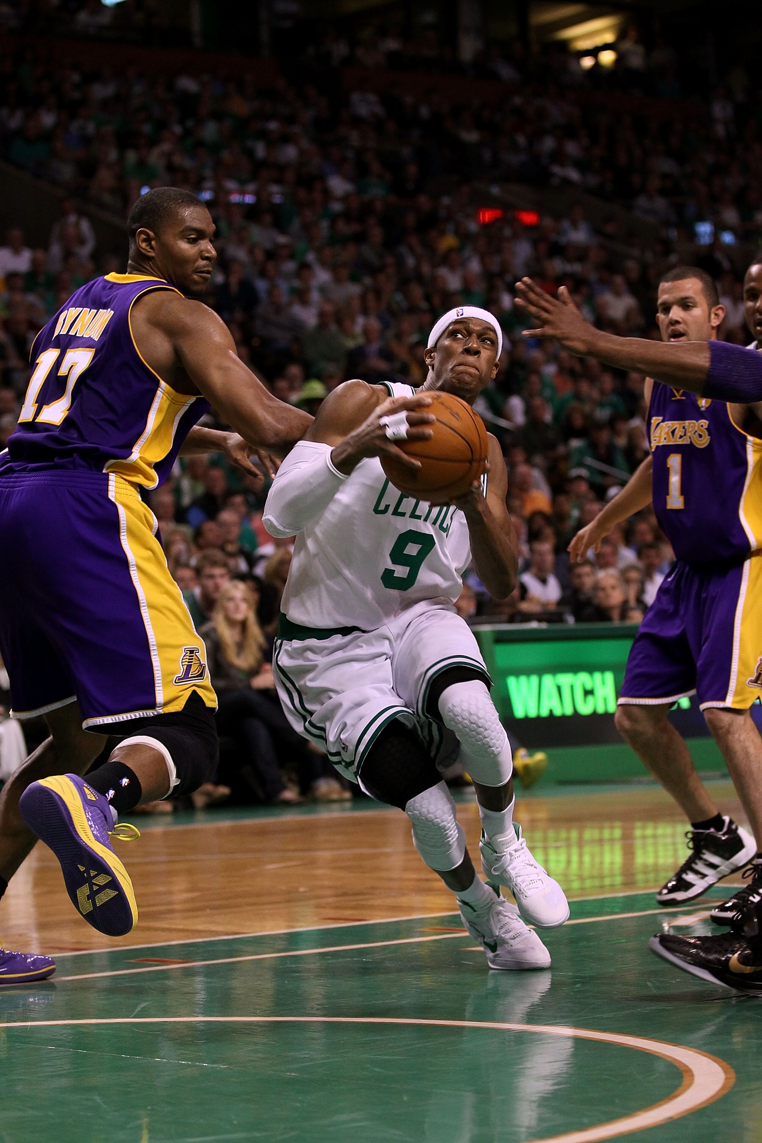 BOSTON - JUNE 13:  Rajon Rondo #9 of the Boston Celtics drives to the basket against Andrew Bynum #17 of the Los Angeles Lakers in the second quarter during Game Five of the 2010 NBA Finals on June 13, 2010 at TD Garden in Boston, Massachusetts. NOTE TO U
