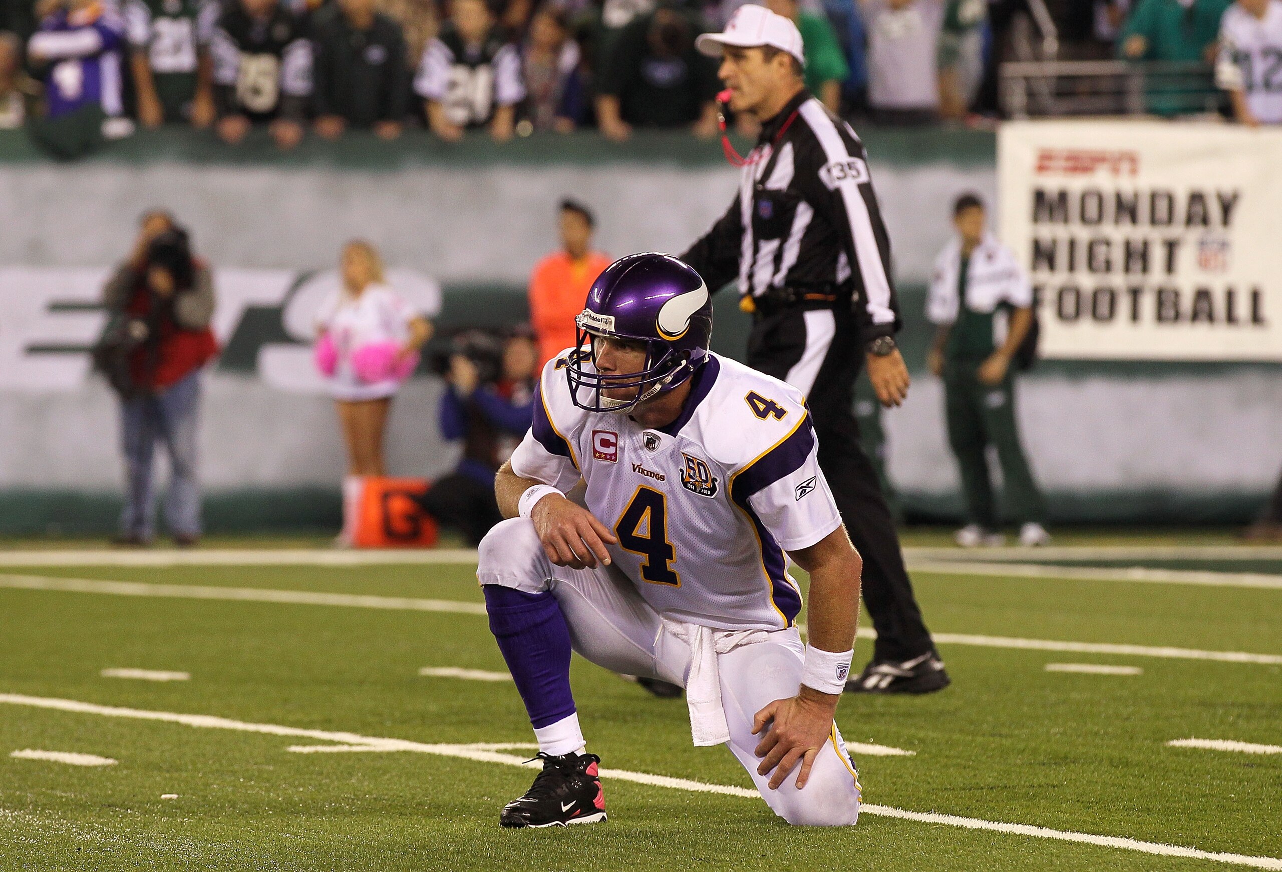 EAST RUTHERFORD, NJ - OCTOBER 11:  Quarterback Brett Favre #4 of the Minnesota Vikings looks on as he picks himself up off the turf in the second half against the New York Jets at New Meadowlands Stadium on October 11, 2010 in East Rutherford, New Jersey.