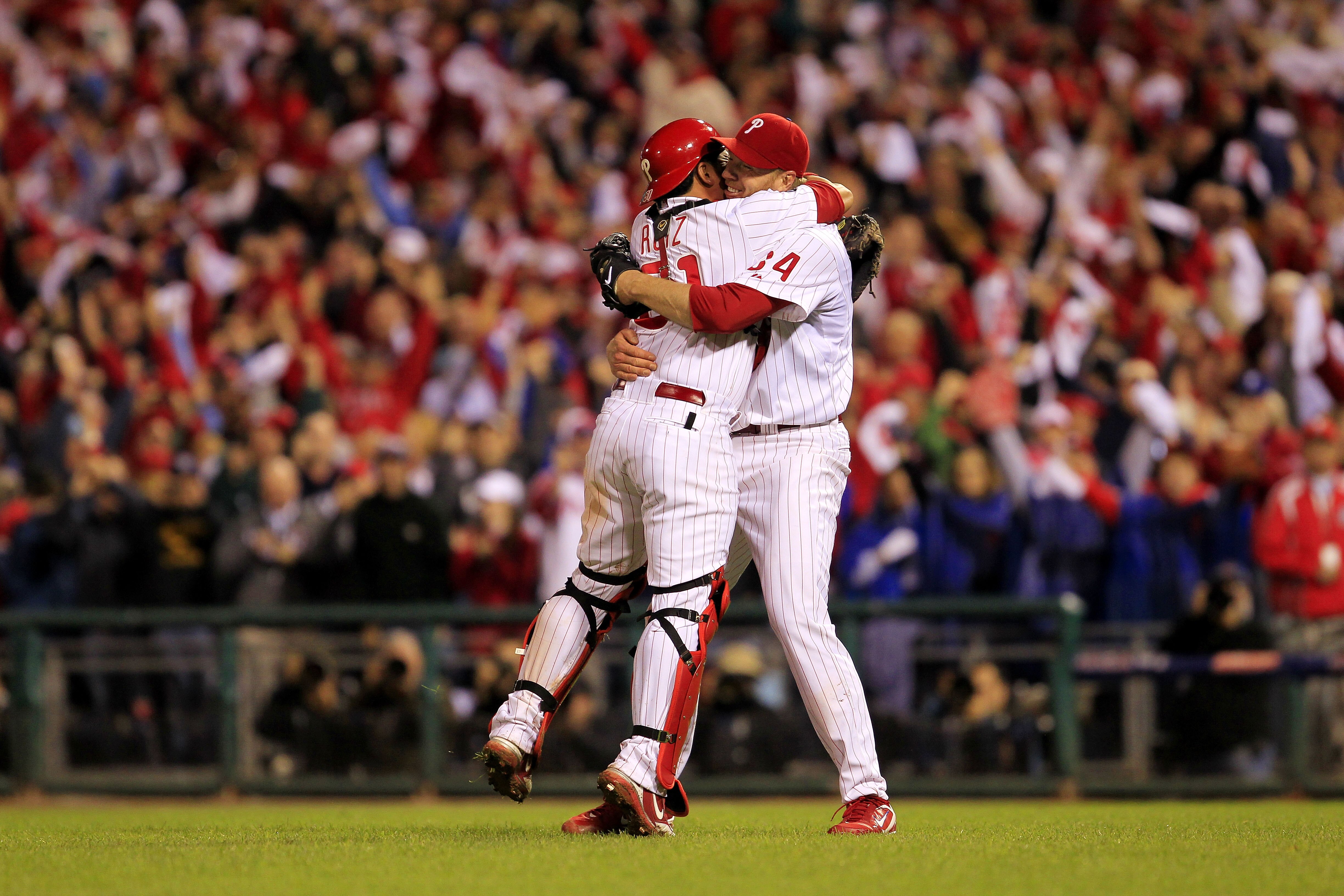 PHILADELPHIA - OCTOBER 06:  Roy Halladay #34 and Carlos Ruiz #51 of the Philadelphia Phillies celebrate Halladay's no-hitter and the win in Game 1 of the NLDS against the Cincinnati Reds at Citizens Bank Park on October 6, 2010 in Philadelphia, Pennsylvan