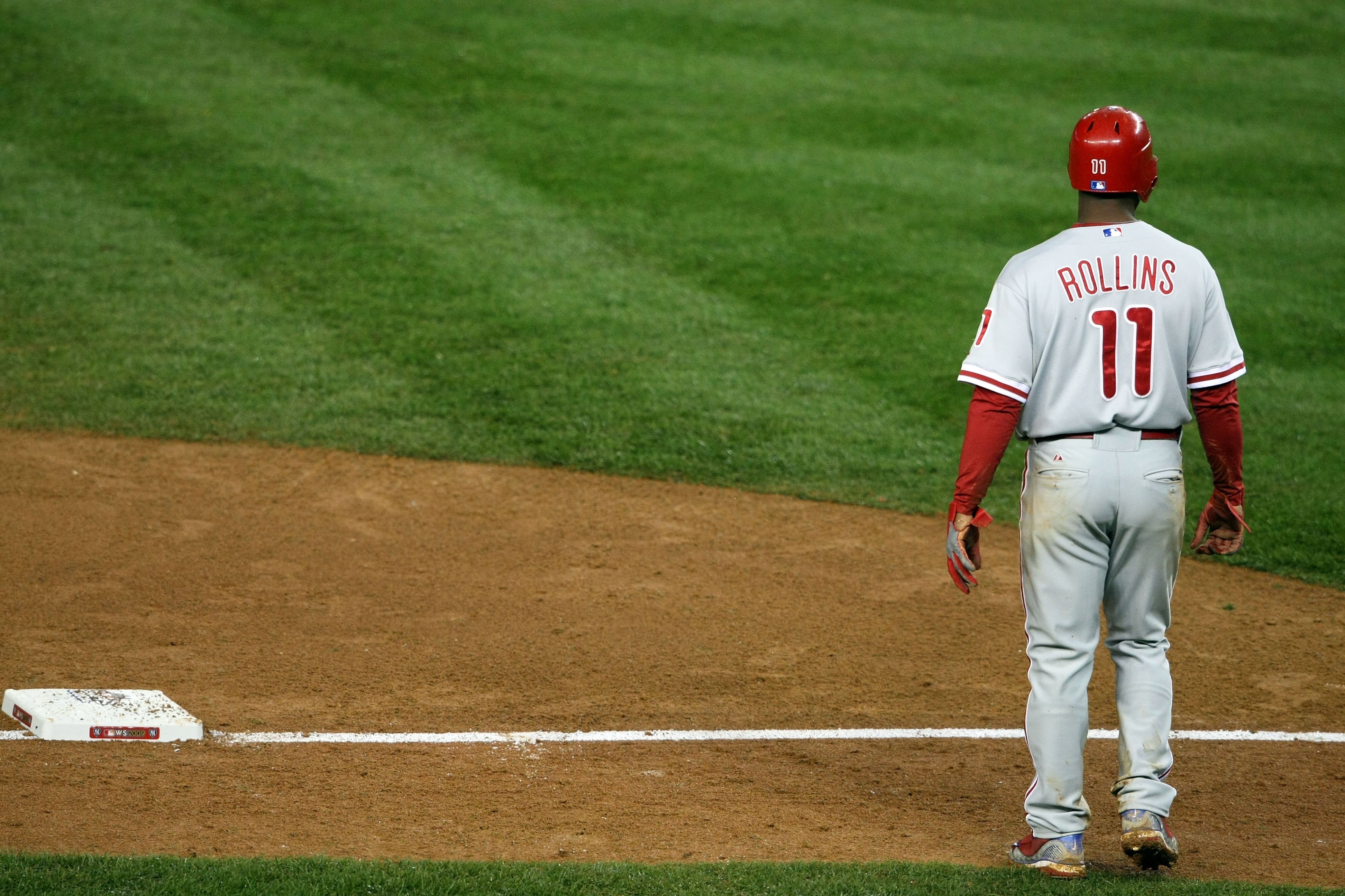 NEW YORK - OCTOBER 28:  Jimmy Rollins #11 of the Philadelphia Phillies leads off of third base against the New York Yankees in Game One of the 2009 MLB World Series at Yankee Stadium on October 28, 2009 in the Bronx borough of New York City.  (Photo by Ni