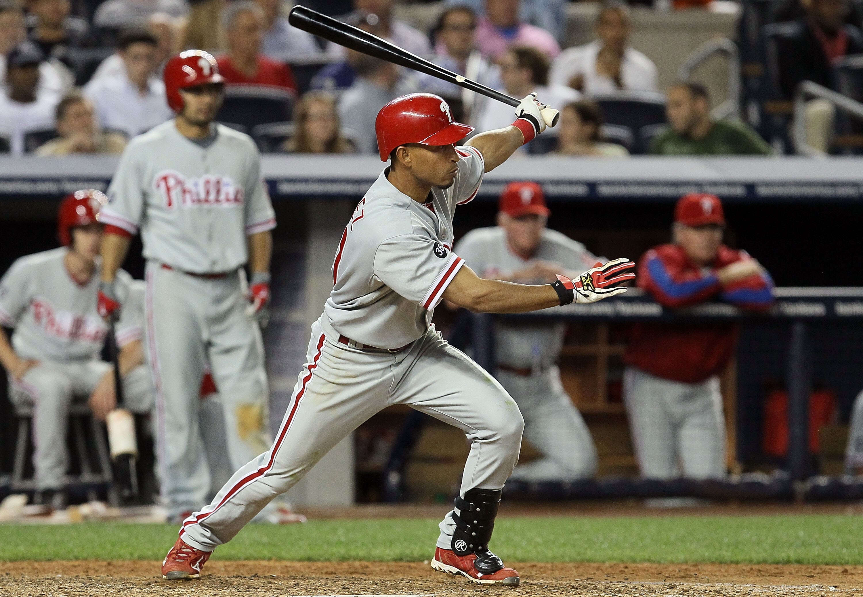 NEW YORK - JUNE 17:  Wilson Valdez #21 of the Philadelphia Phillies follows through on a RBI single in the ninth inning against the New York Yankees on June 17, 2010 at Yankee Stadium in the Bronx borough of New York City. The Phillies defeated the Yankee