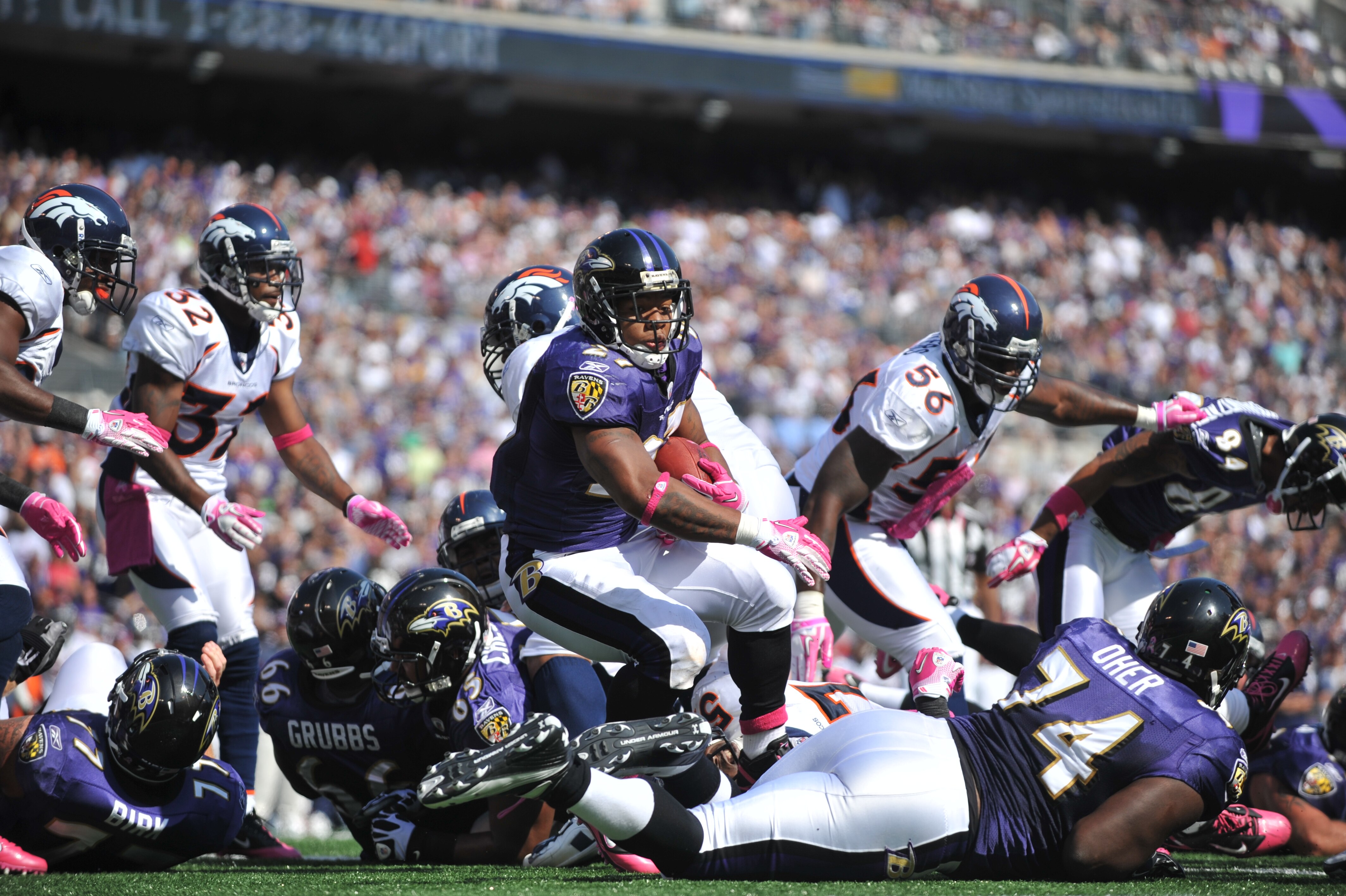BALTIMORE, MD - OCTOBER 10:  Ray Rice #27 of the Baltimore Ravens scores a touchdown against the Denver Broncos at M&T Bank Stadium on October 10, 2010 in Baltimore, Maryland. Players wore pink in recognition of Breast Cancer Awareness Month. The Ravens d