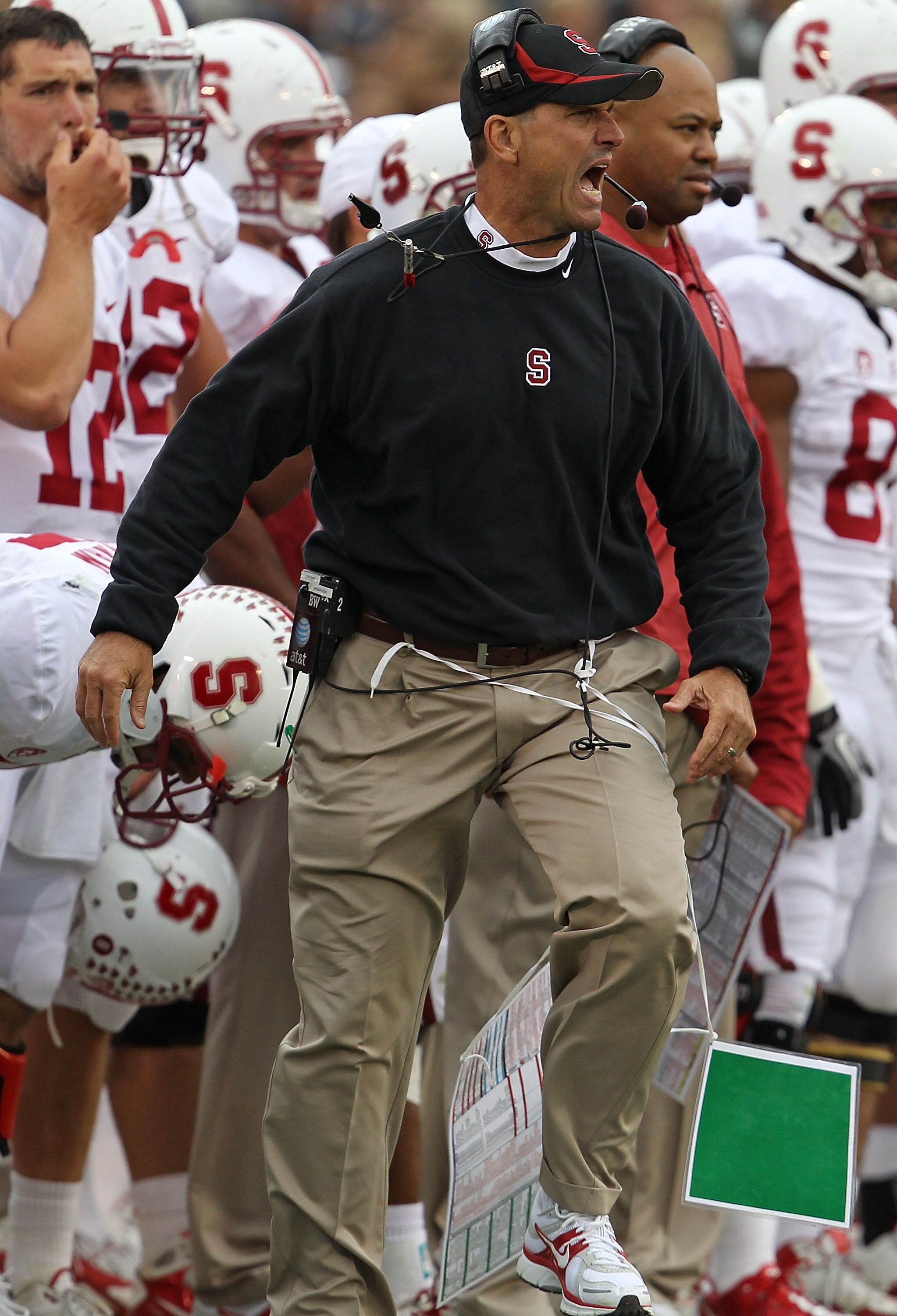 SOUTH BEND, IN - SEPTEMBER 25: Head coach Jim Harbaugh of the Stanford Cardinal yells as he watches his team take on the Notre Dame Fighting Irish at Notre Dame Stadium on September 25, 2010 in South Bend, Indiana. Stanford defeated Notre Dame 37-14. (Pho