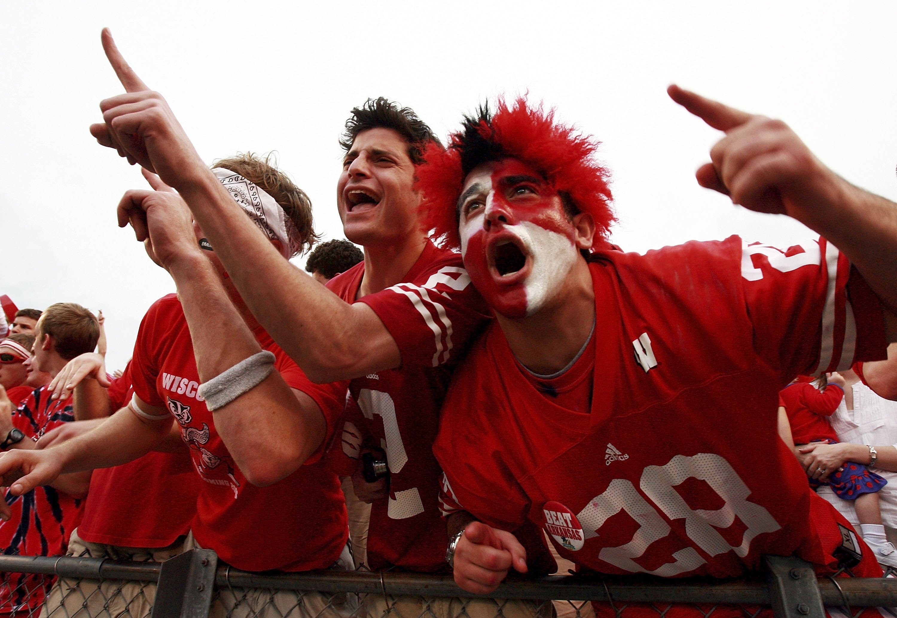 ORLANDO, FL - JANUARY 1:  Fans of the Wisconsin Badgers celebrate after defeating the Arkansas Razorbacks in the Capitol One Bowl at Florida Citrus Bowl January 1, 2007 in Orlando, Florida. Wisconsin defeated Arkansas 17-14.  (Photo by Doug Benc/Getty Ima