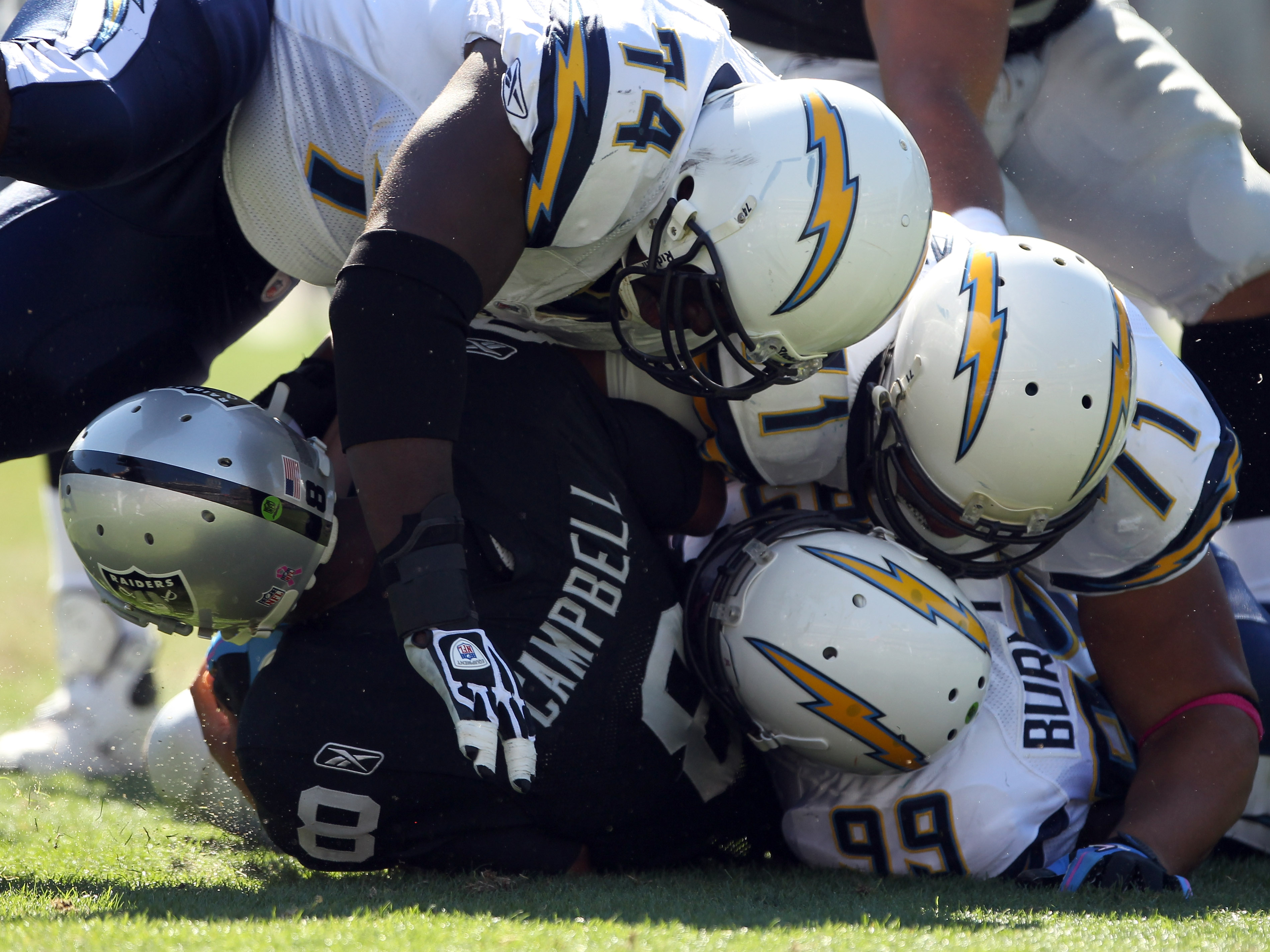 OAKLAND, CA - OCTOBER 10:  Jason Campbell #8 of the Oakland Raiders is tackled by the San Diego Chargers at Oakland-Alameda County Coliseum on October 10, 2010 in Oakland, California.  (Photo by Ezra Shaw/Getty Images)