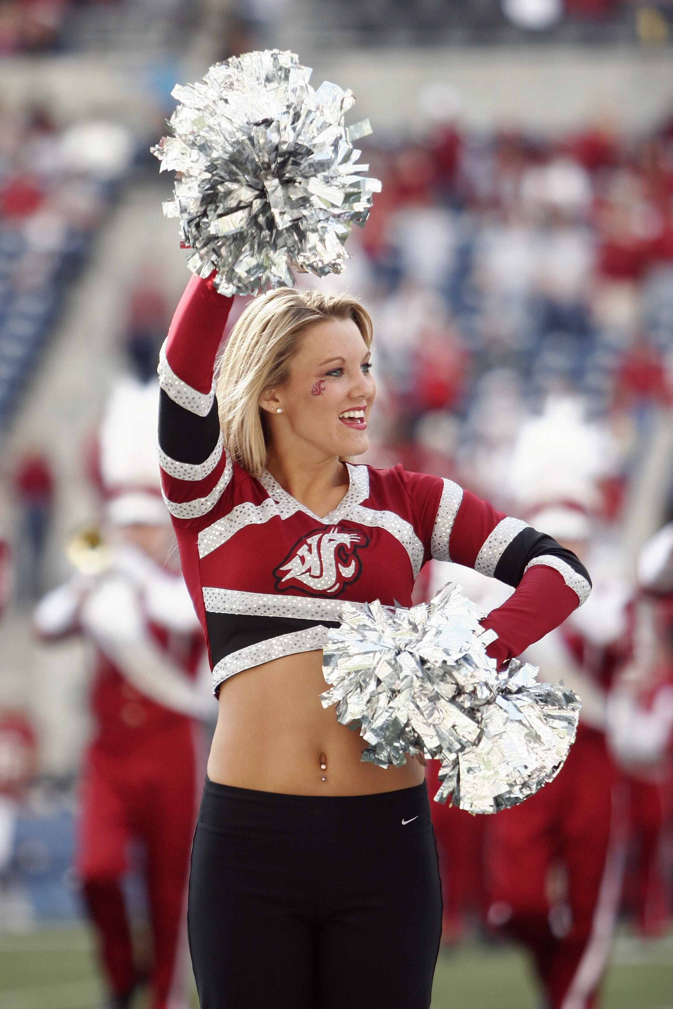 SEATTLE - SEPTEMBER 17:  A Washington State University Cougars cheerleader entertains the fans during a NCAA game against the Grambling State University Tigers at Quest Field on September 17, 2005 in Seattle Washington.  Washington State won 48-7.  (Photo