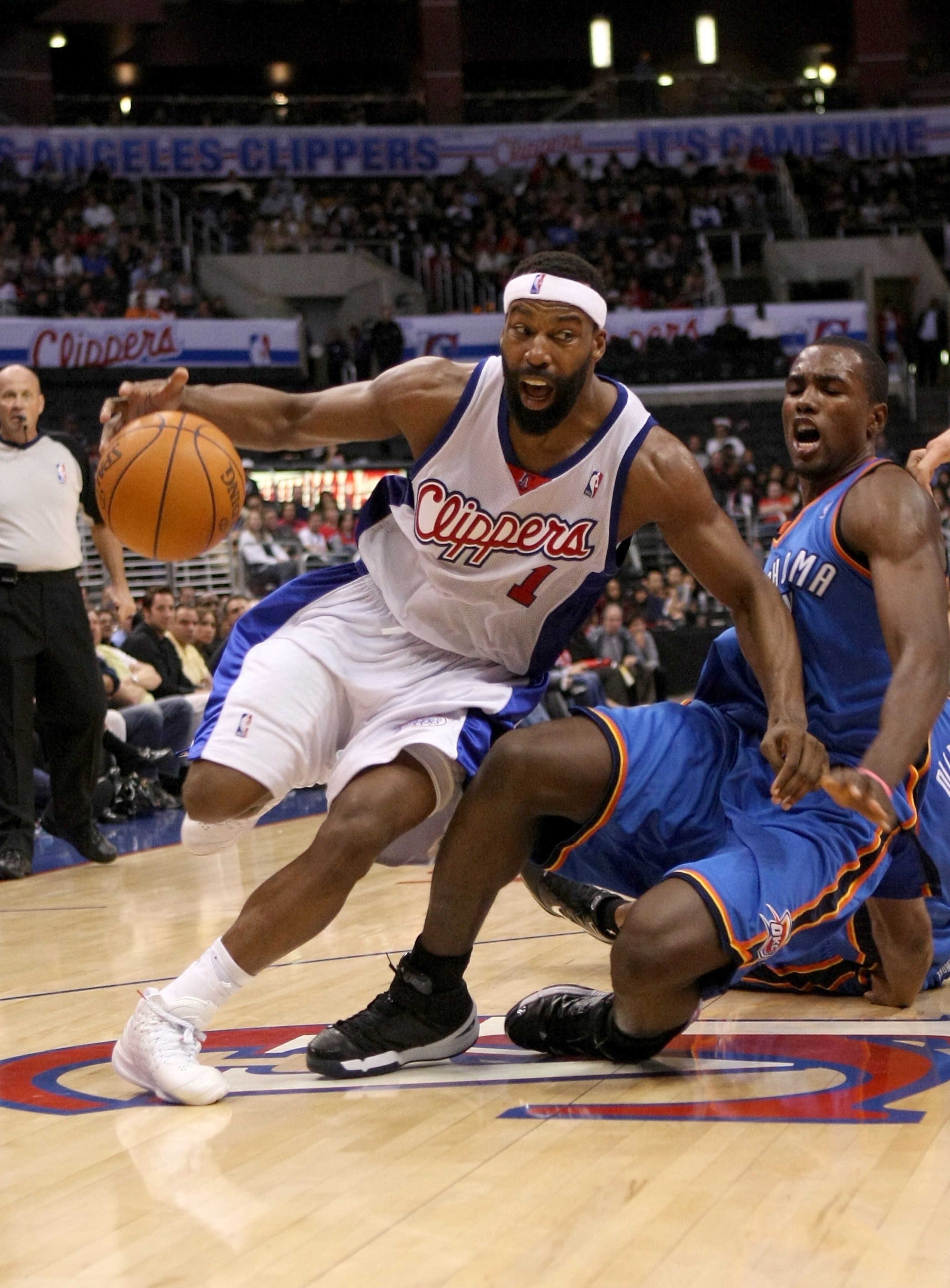 LOS ANGELES - NOVEMBER 11: Baron Davis #1 of the Los Angeles Clippers drives around Serge Ibaka #9 of the Oklahoma City Thunder on November 11, 2009 at Staples Center in Los Angeles, California.  The Thunder won 83-79.   NOTE TO USER: User expressly ackno