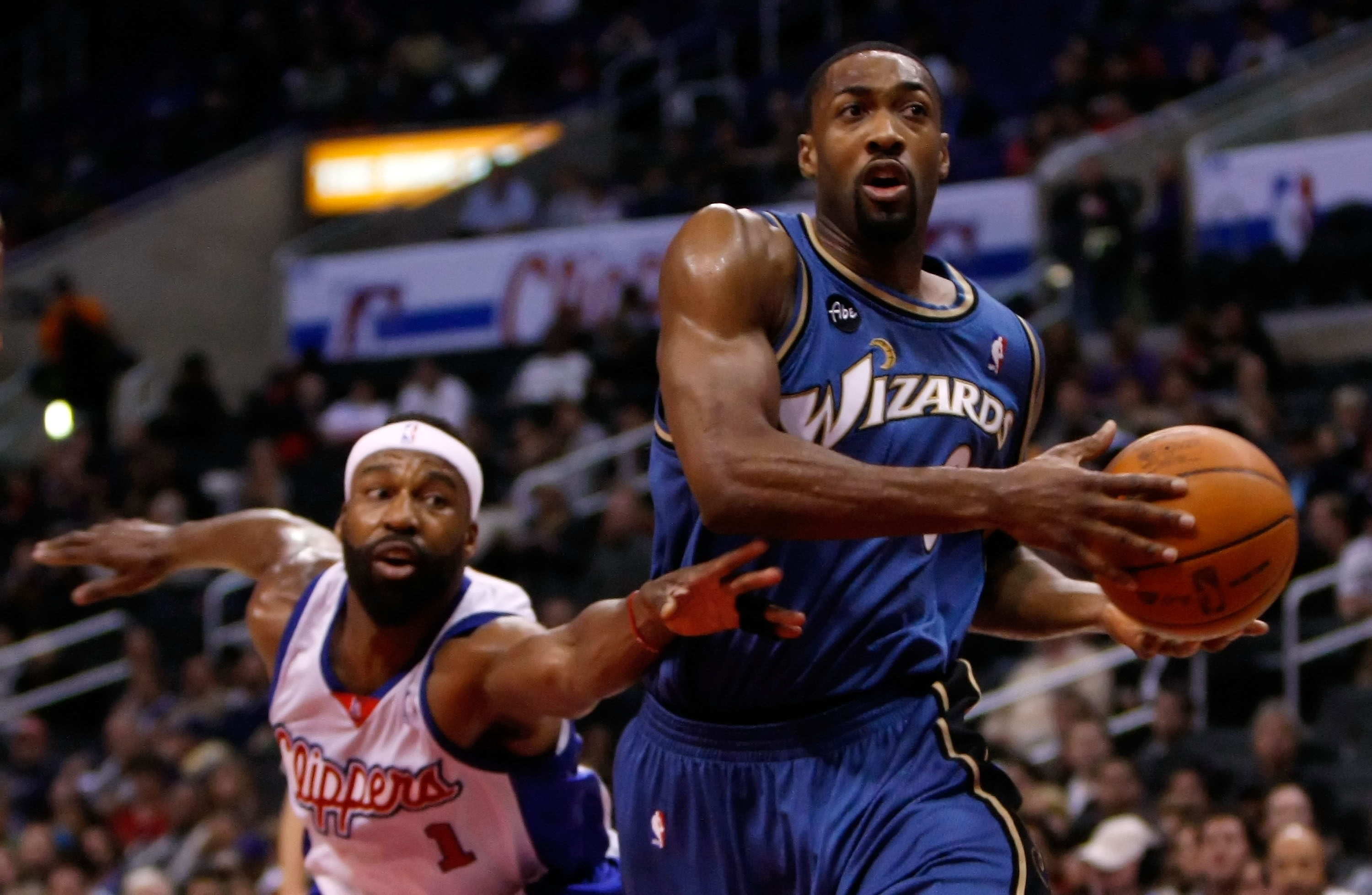 LOS ANGELES, CA - DECEMBER 14:  Gilbert Arenas #0 of the Washington Wizards drives to the basket as Baron Davis #1 of the Los Angeles Clippers lunges to steal the ball in the first half at Staples Center on December 14, 2009 in Los Angeles, California. NO