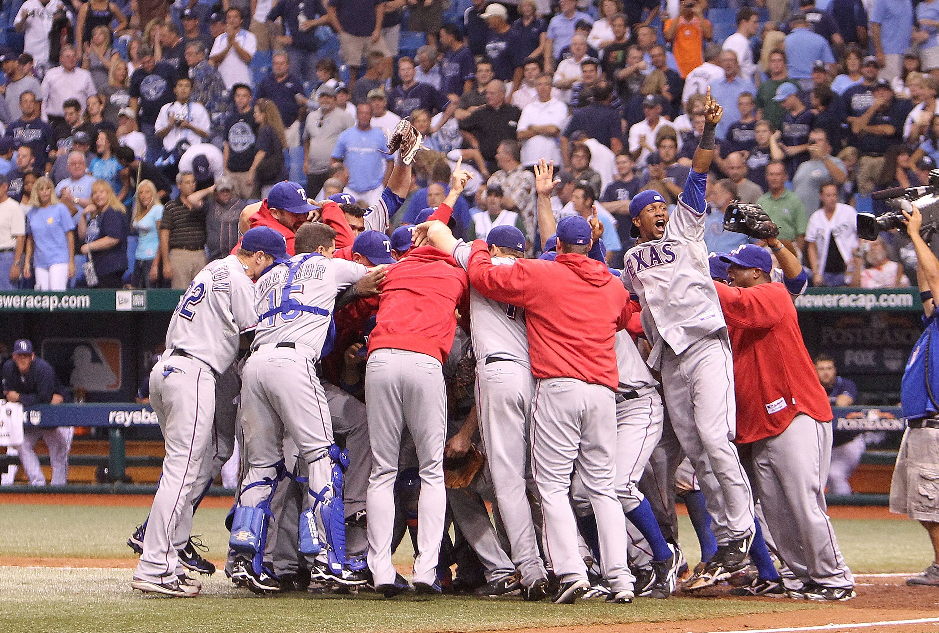 ST. PETERSBURG, FL - OCTOBER 12:  The Texas Rangers celebrate after winning Game 5 of the ALDS against the Tampa Bay Rays at Tropicana Field on October 12, 2010 in St. Petersburg, Florida.  (Photo by Mike Ehrmann/Getty Images)