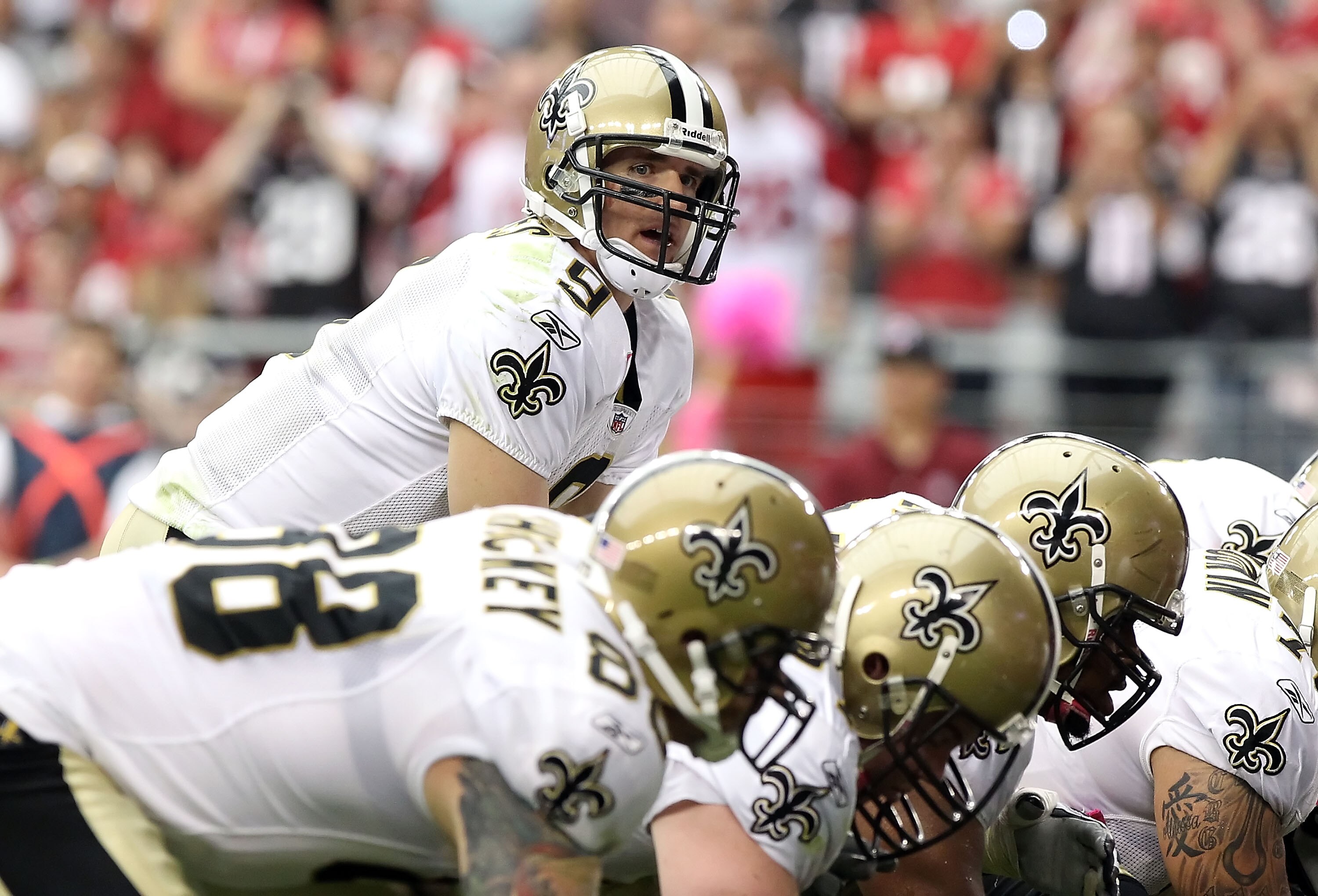 GLENDALE, AZ - OCTOBER 10:  Quarterback Drew Brees #9 of the New Orleans Saints prepares to snap the ball during the NFL game against the Arizona Cardinals at the University of Phoenix Stadium on October 10, 2010 in Glendale, Arizona. The Cardinals defeat