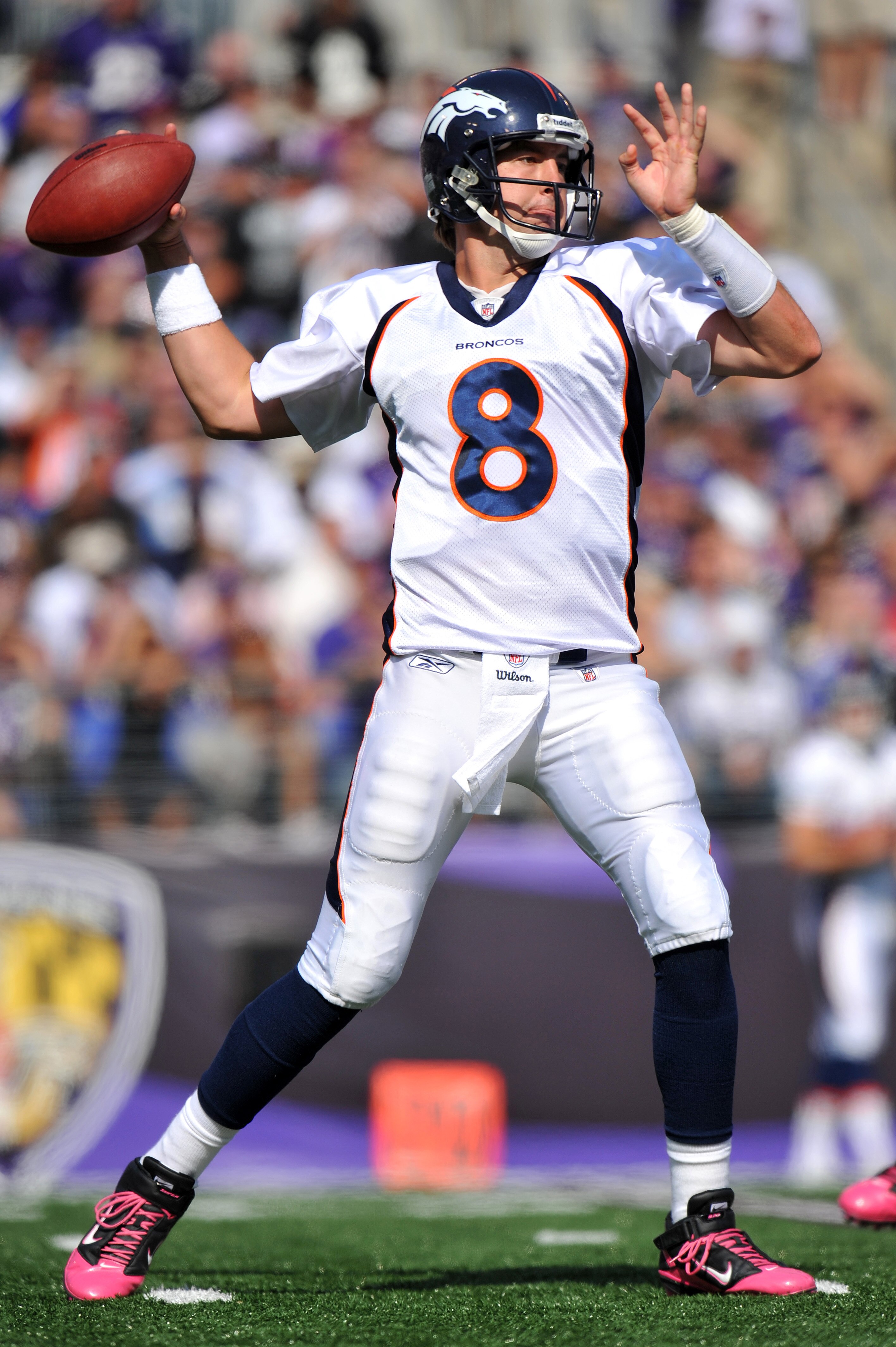 BALTIMORE, MD - OCTOBER 10:  Kyle Orton #8 of the Denver Broncos passes against the Baltimore Ravens at M&T Bank Stadium on October 10, 2010 in Baltimore, Maryland. Players wore pink in recognition of Breast Cancer Awareness Month. The Ravens defeated the