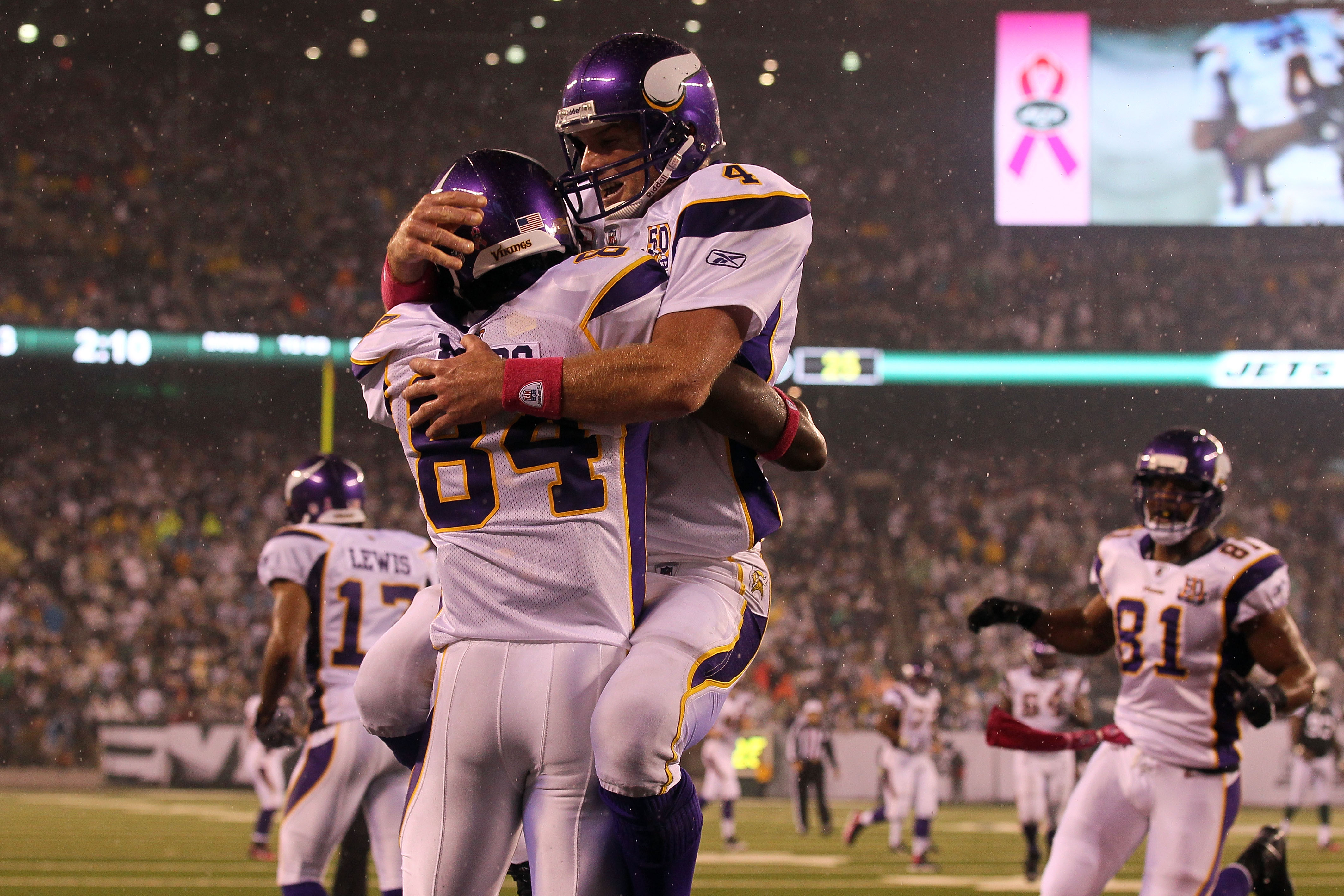 EAST RUTHERFORD, NJ - OCTOBER 11:  Brett Favre #4 and Randy Moss #84 of the Minnesota Vikings celebrate after Moss caught a 37-yard touchdown pass from Favre in the third quarter against the New York Jets at New Meadowlands Stadium on October 11, 2010 in