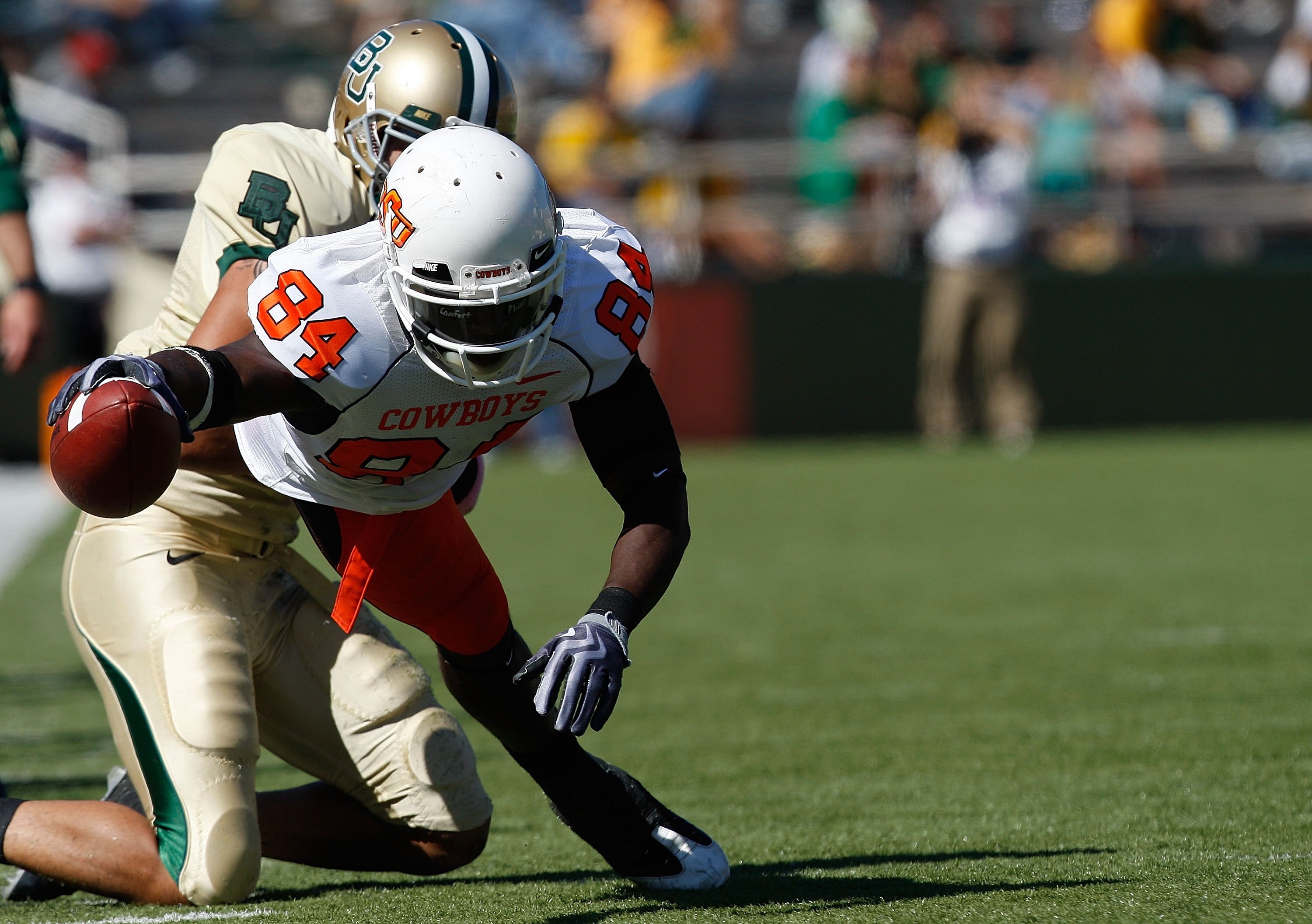 WACO, TX - OCTOBER 24:  Hubert Anyiam #84 of the Oklahoma State Cowboys runs the ball against the Baylor Bears at Floyd Casey Stadium on October 24, 2009 in Waco, Texas.  (Photo by Ronald Martinez/Getty Images)