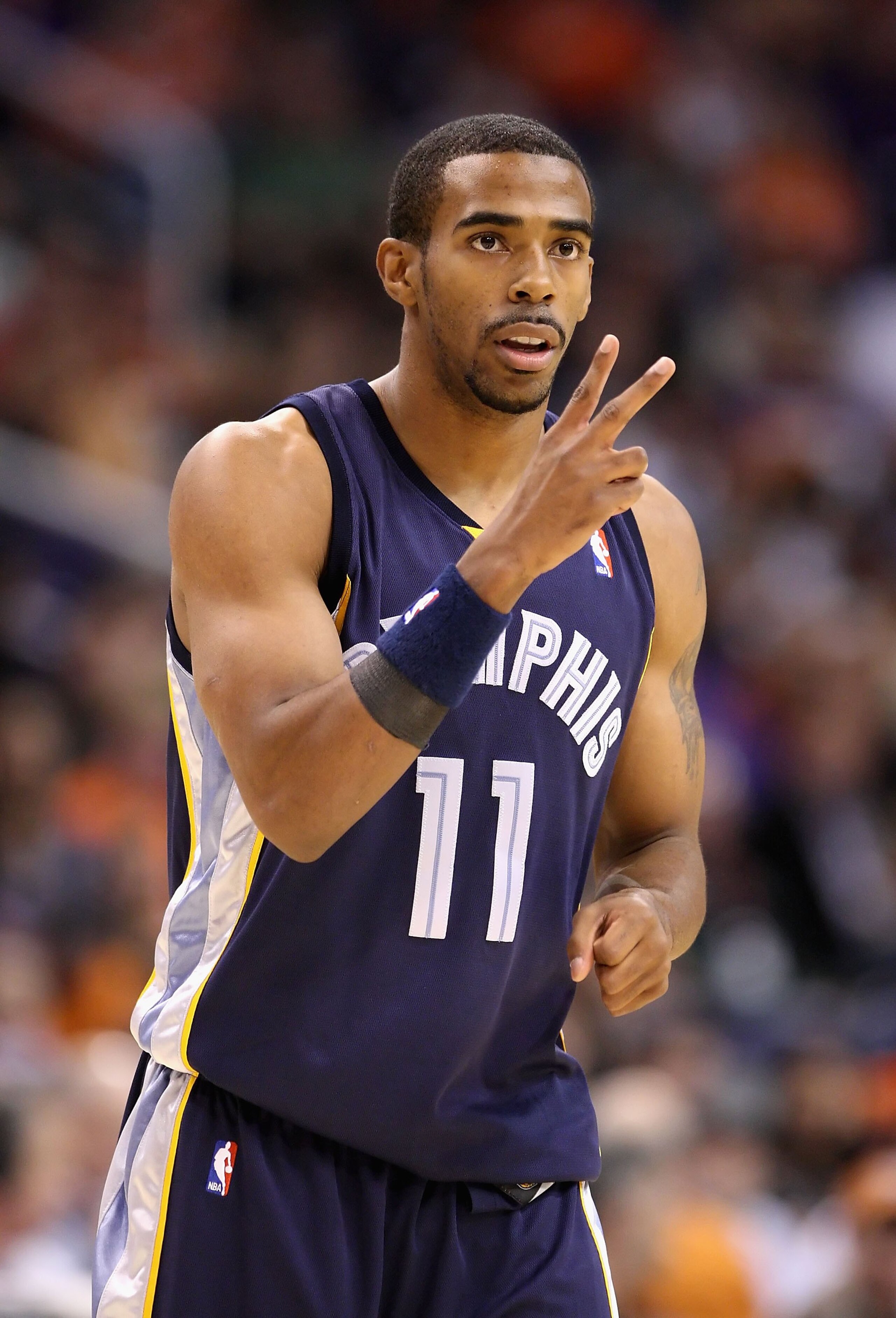 PHOENIX - NOVEMBER 25: Mike Conley #11 of the Memphis Grizzlies during the NBA game against the Phoenix Suns at US Airways Center on November 25, 2009 in Phoenix, Arizona. The Suns defeated the Grizzlies 126-111. NOTE TO USER: User expressly acknowledg PHOENIX - NOVEMBER 25: Mike Conley #11 of the Memphis Grizzlies during the NBA game against the Phoenix Suns at US Airways Center on November 25, 2009 in Phoenix, Arizona. The Suns defeated the Grizzlies 126-111. NOTE TO USER: User expressly acknowledg