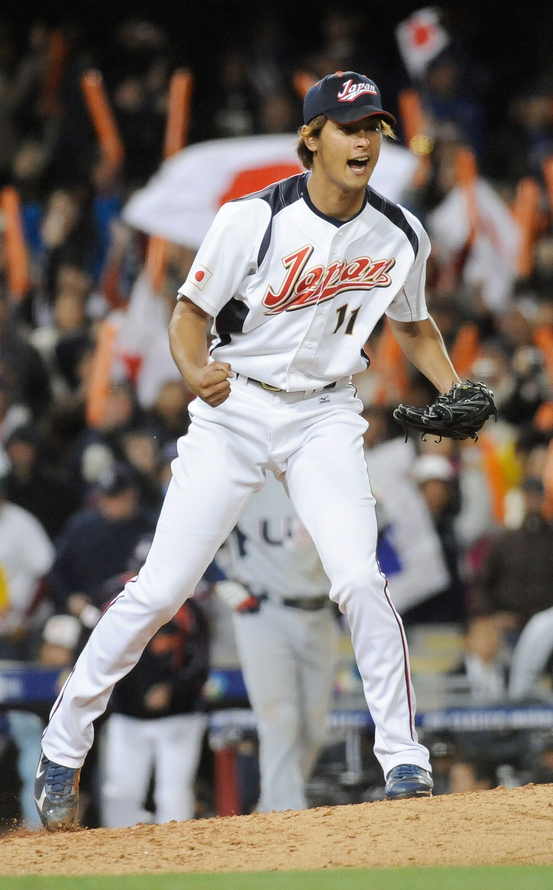 LOS ANGELES - MARCH 22: Pitcher Yu Darvish #11 of Japan celebrates after striking out Adam Dunn #17 of the United States to win the semifinal game of the 2009 World Baseball Classic on March 22, 2009 at Dodger Stadium in Los Angeles, California. Japan def