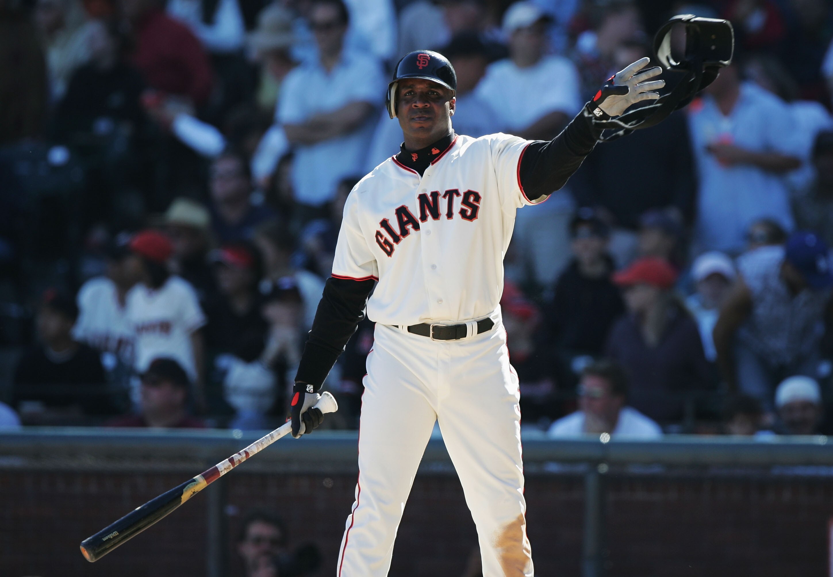 SAN FRANCISCO - SEPTEMBER 25:  Barry Bonds #25 of the San Francisco Giants throws his arm pad after he was intentionaly walked against the Los Angeles Dodgers at SBC Park on September 25, 2004 in San Francisco, California. (Photo by Jed Jacobsohn/Getty Im