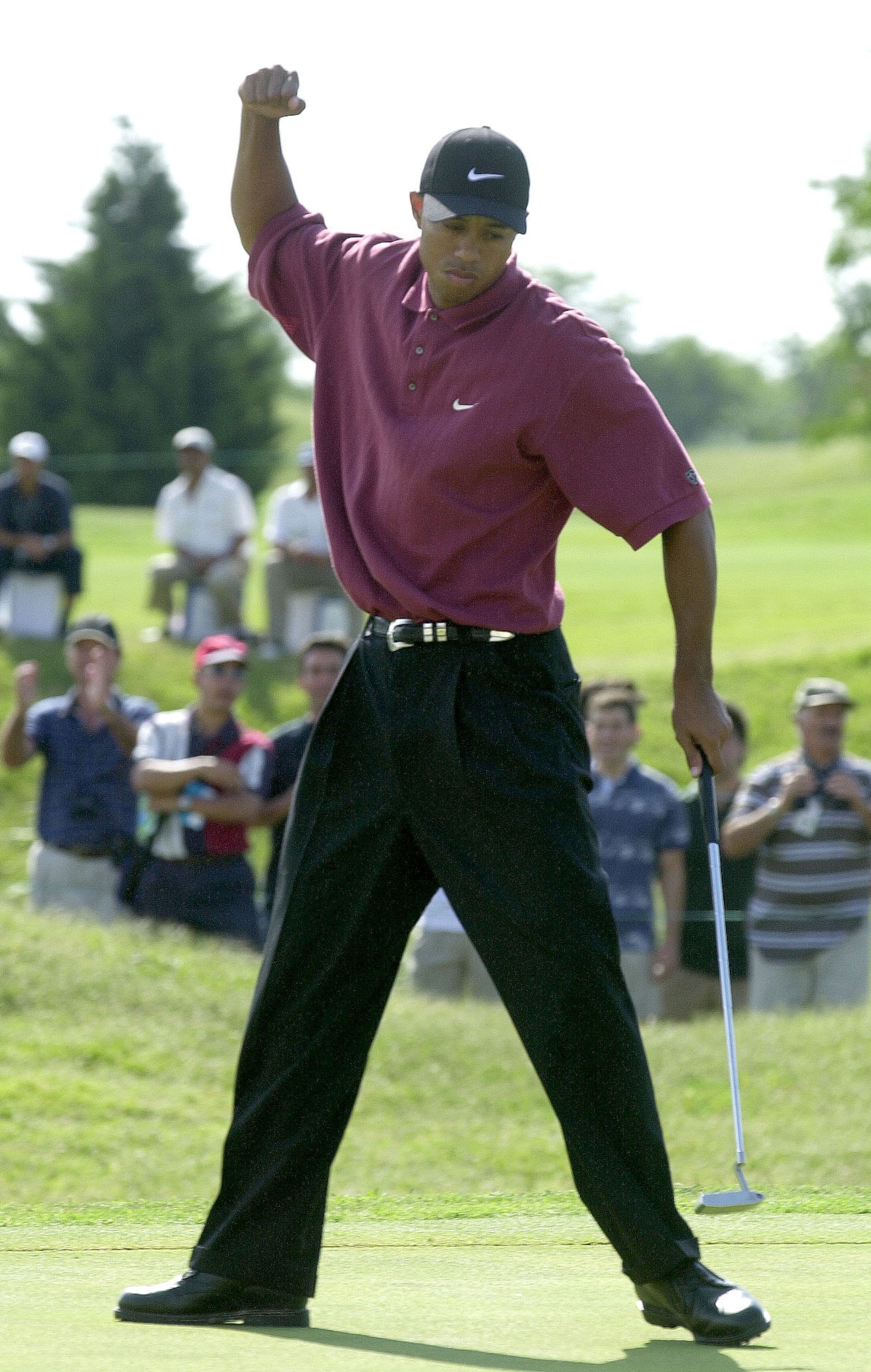 10 Dec 2000:  Tiger Woods celebrates a birdie on the 11th hole during the final round of the World Cup of Golf at the Buenos Aires Golf Club in Buenos Aires, Argentina. The USA went on to win the tournament.  DIGITAL IMAGE. Mandatory Credit: Harry How/ALL