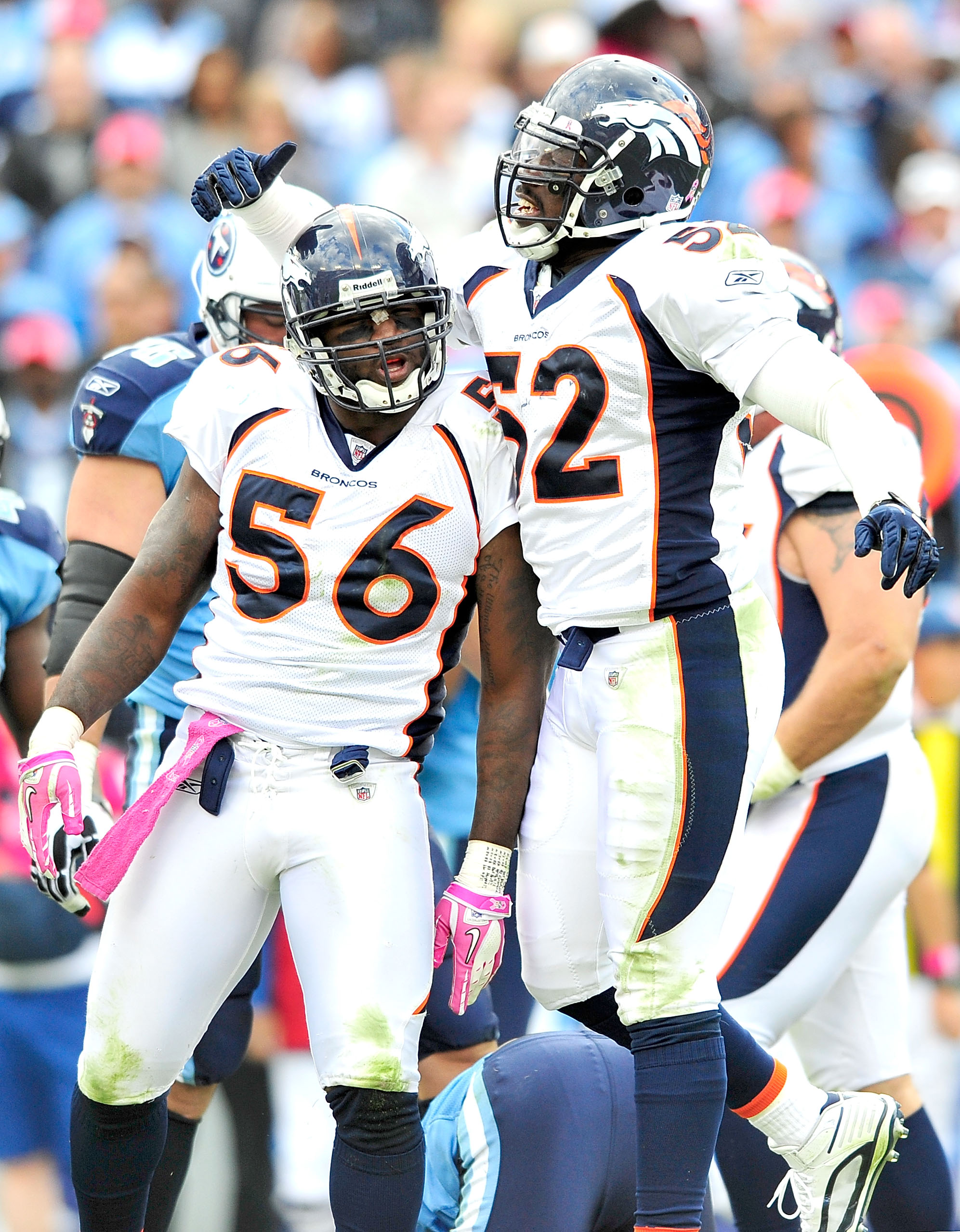 NASHVILLE, TN - OCTOBER 03:  Robert Ayers #56 and Jason Hunter #52 of the Denver Broncos celebrate after a defensive stop against the Tennessee Titans  at LP Field on October 3, 2010 in Nashville, Tennessee. Denver won 26-20.  (Photo by Grant Halverson/Ge