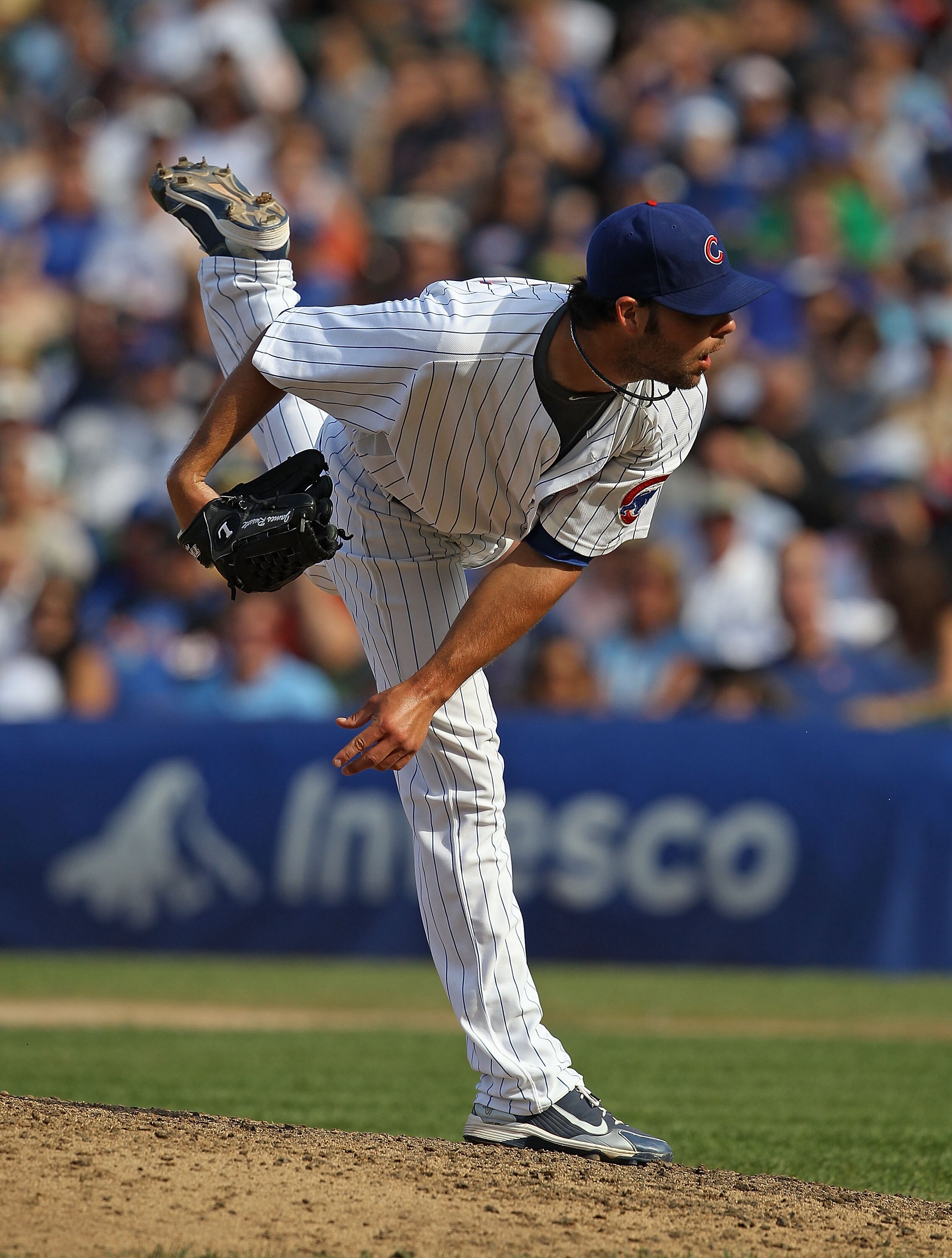 CHICAGO - SEPTEMBER 05: James Russell #40 of the Chicago Cubs follows through after pitching against the New York Mets at Wrigley Field on September 5, 2010 in Chicago, Illinois. The Mets defeated the Cubs 18-5. (Photo by Jonathan Daniel/Getty Images)