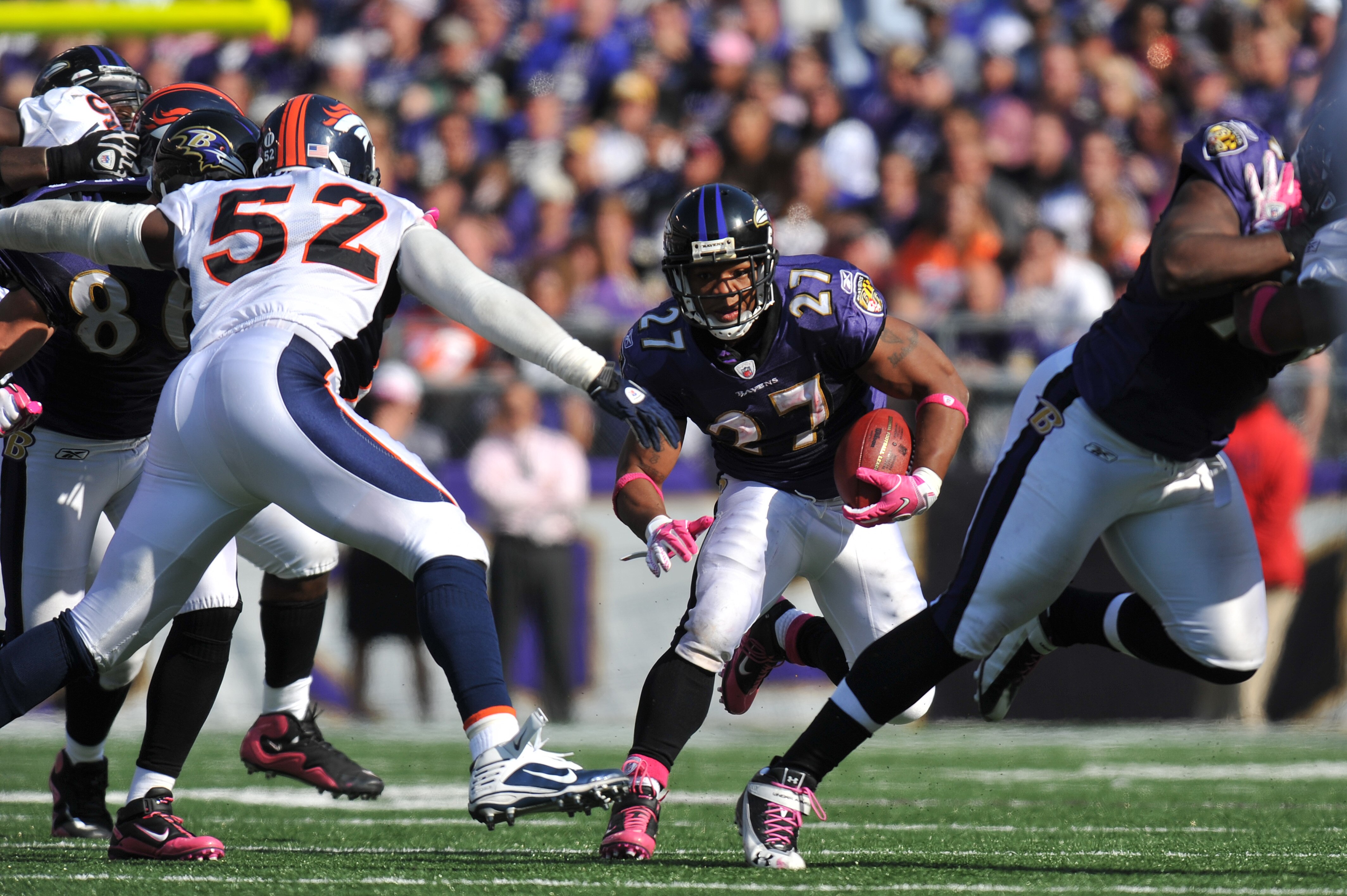 BALTIMORE, MD - OCTOBER 10:  Ray Rice #27 of the Baltimore Ravens runs the ball against the Denver Broncos at M&T Bank Stadium on October 10, 2010 in Baltimore, Maryland. Players wore pink in recognition of Breast Cancer Awareness Month. The Ravens defeat
