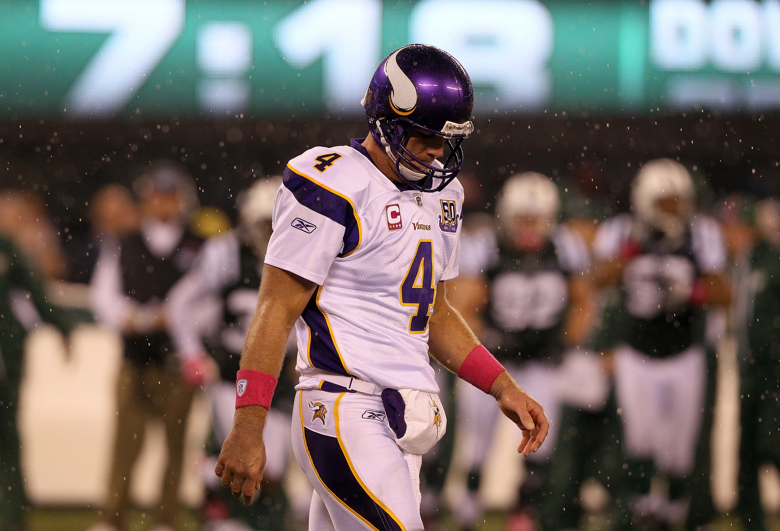 EAST RUTHERFORD, NJ - OCTOBER 11:  Quarterback Brett Favre #4 of the Minnesota Vikings walks back to the sideline against the New York Jets at New Meadowlands Stadium on October 11, 2010 in East Rutherford, New Jersey.  (Photo by Jim McIsaac/Getty Images)