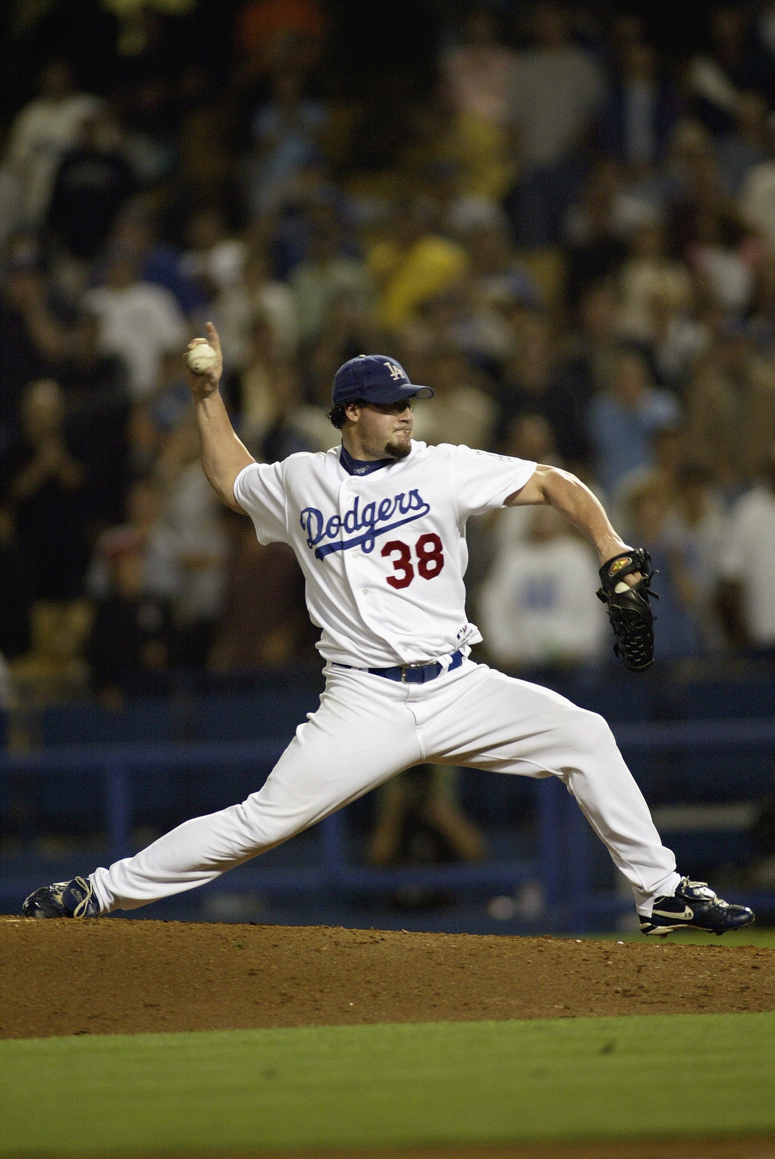 LOS ANGELES - SEPTEMBER 2:  Eric Gagne relief pitcher for the Los Angeles Dodgers throws the last pitch of the game against the Houston Astros' Craig Biggio  to get his 47th consecutive save of the season and his 55th consecutive save including the end of