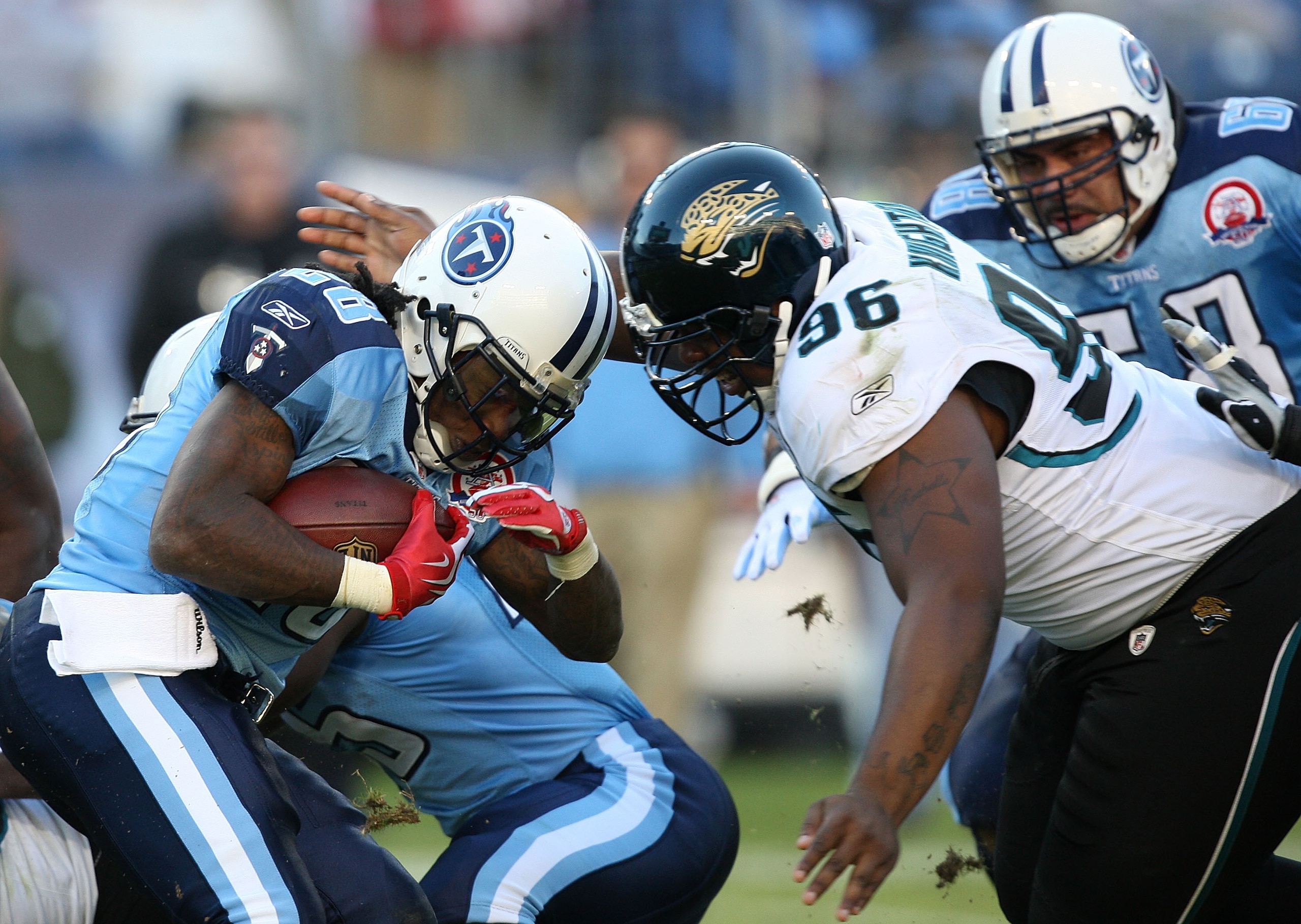 NASHVILLE, TN - NOVEMBER 01:  Terrance Knighton #96 of the Jacksonville Jaguars tries to stop Chris Johnson #28 of the Tennessee Titans during their game at LP Field on November 1, 2009 in Nashville, Tennessee.  (Photo by Streeter Lecka/Getty Images)