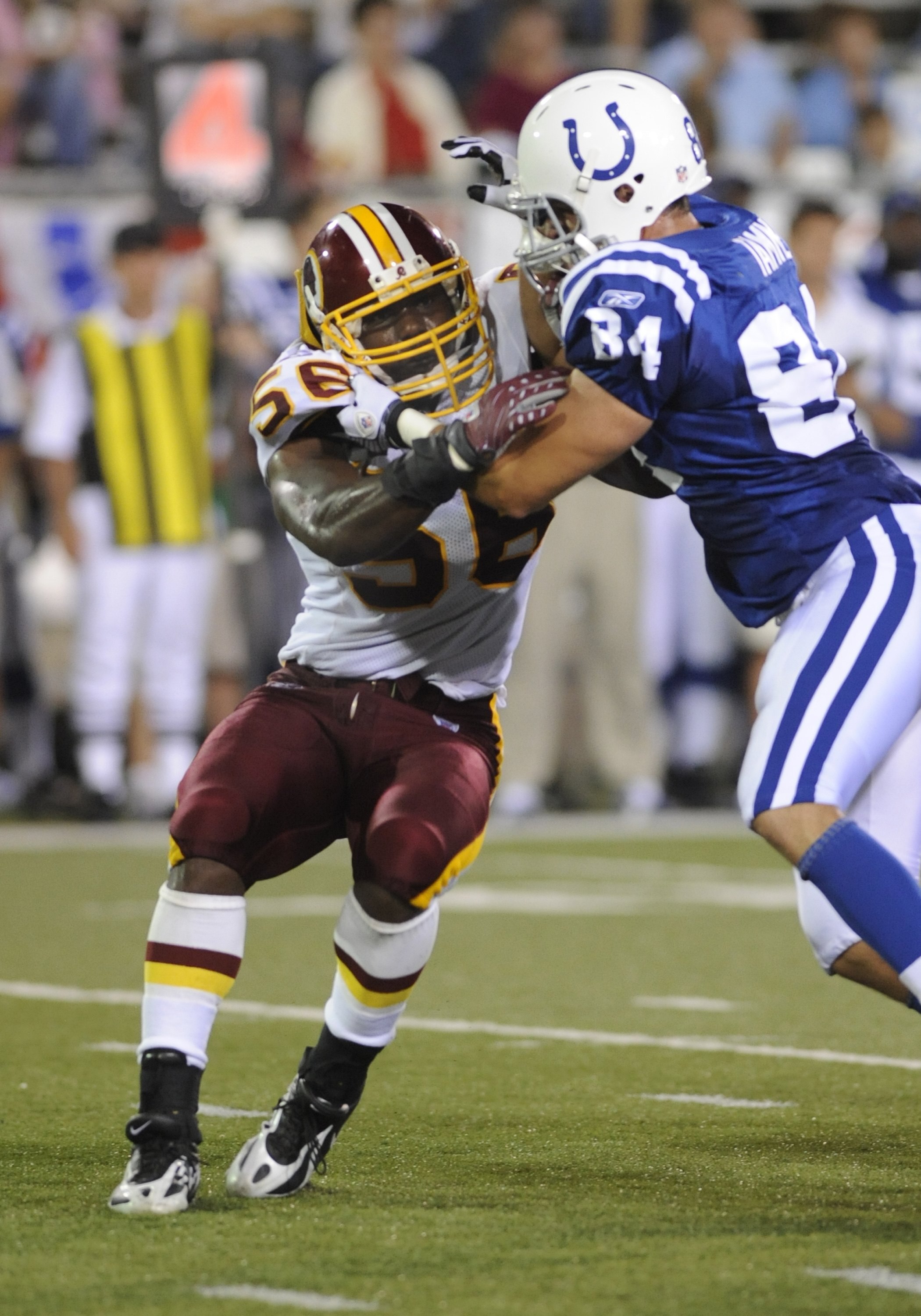 CANTON, OH - AUGUST 3: Linebacker Curtis Gatewood #56 of the Washington Redskins battles against the block of tight end Jacob Tamme #84 of the Indianapolis Colts in the Pro Football Hall of Fame Game at Fawcett Stadium on August 3, 2008 in Canton, Ohio.