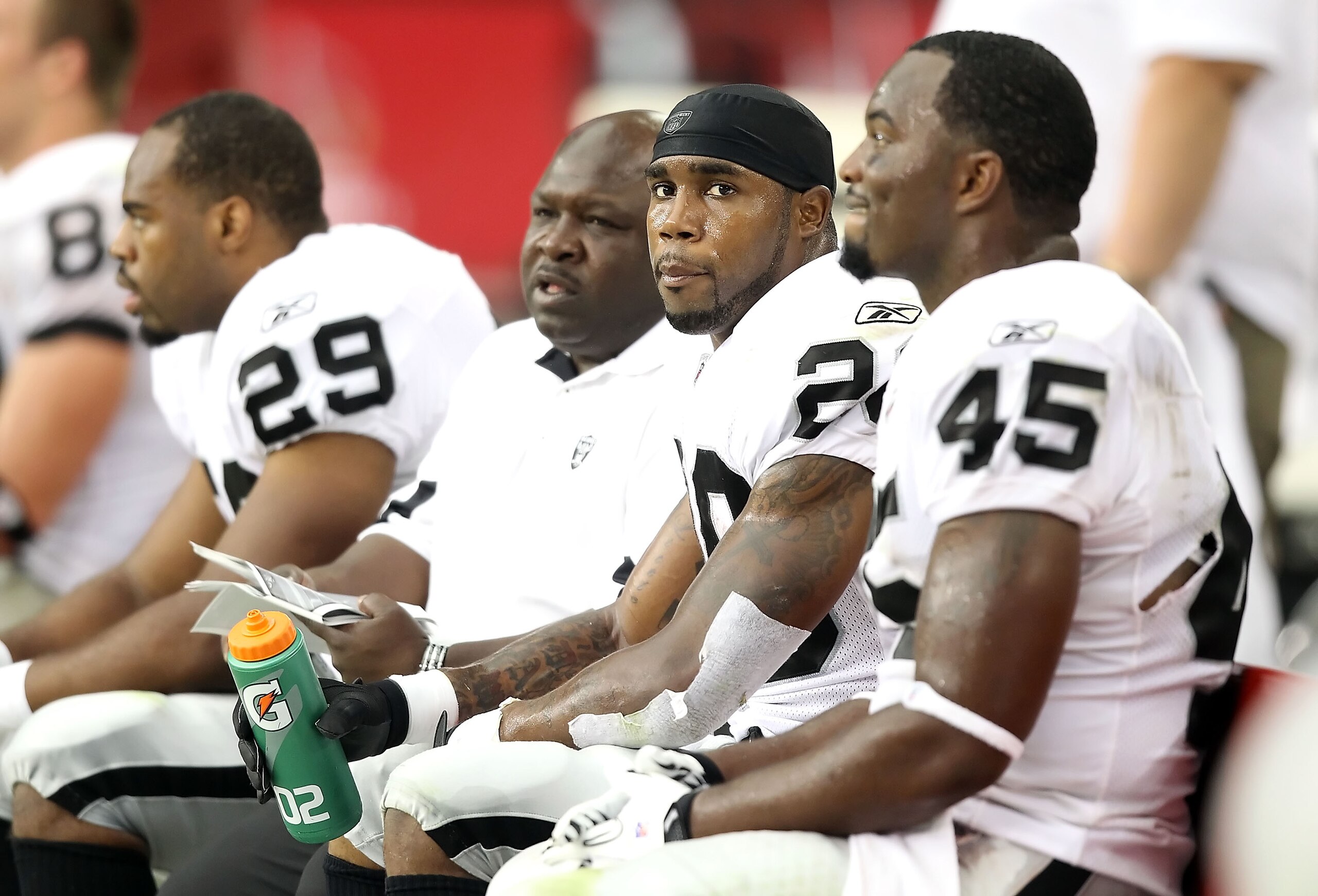 GLENDALE, AZ - SEPTEMBER 26:  Runningback Darren McFadden #20 of the Oakland Raiders sits on the sidelines during the NFL game against the Arizona Cardinals at the University of Phoenix Stadium on September 26, 2010 in Glendale, Arizona.  The Cardinals de