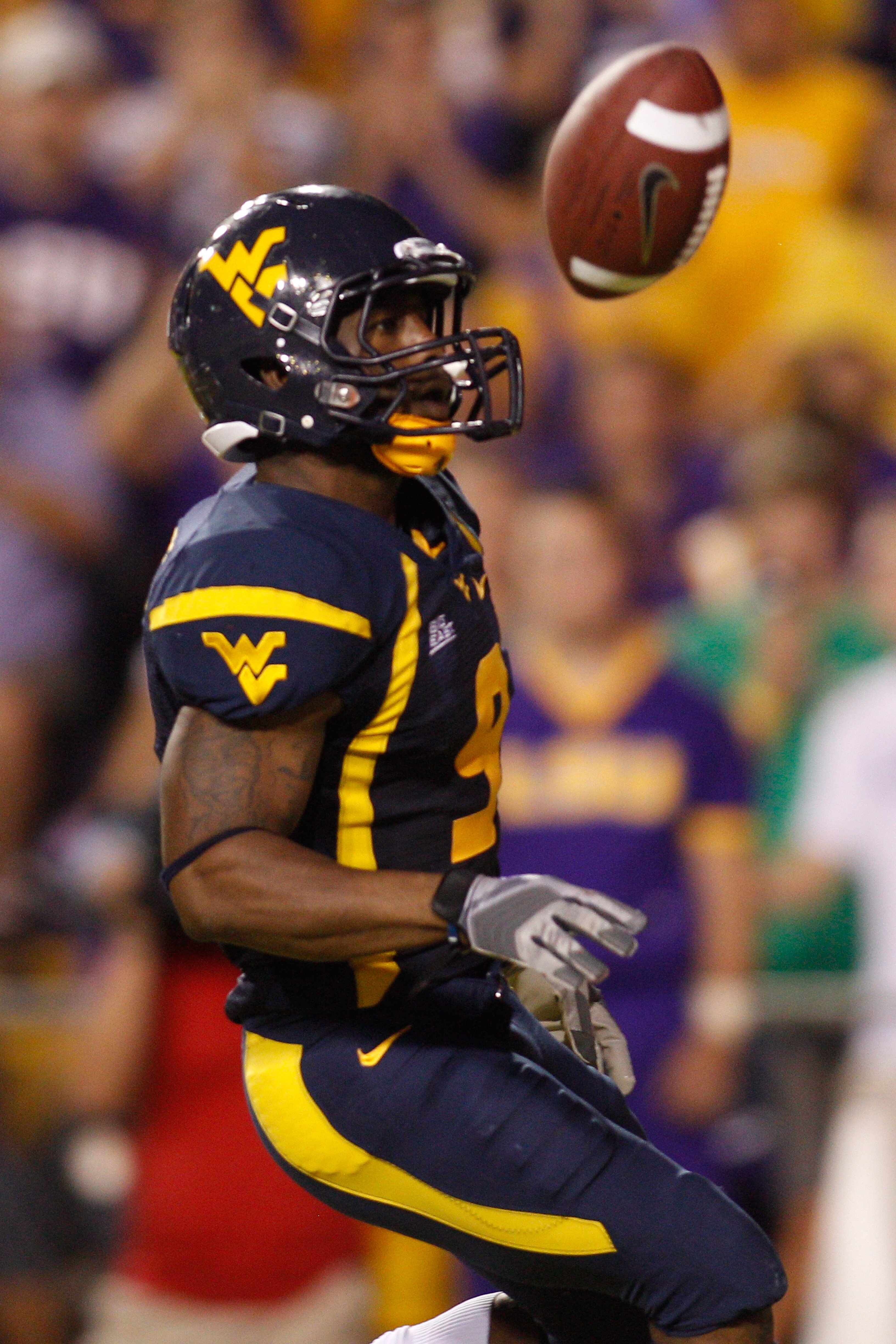 BATON ROUGE, LA - SEPTEMBER 25:   Jock Sanders #9 of the West Virginia Mountaineers celebrates after scoring a touchdown against the  Louisiana State University Tigers at Tiger Stadium on September 25, 2010 in Baton Rouge, Louisiana.  The Tigers defeated