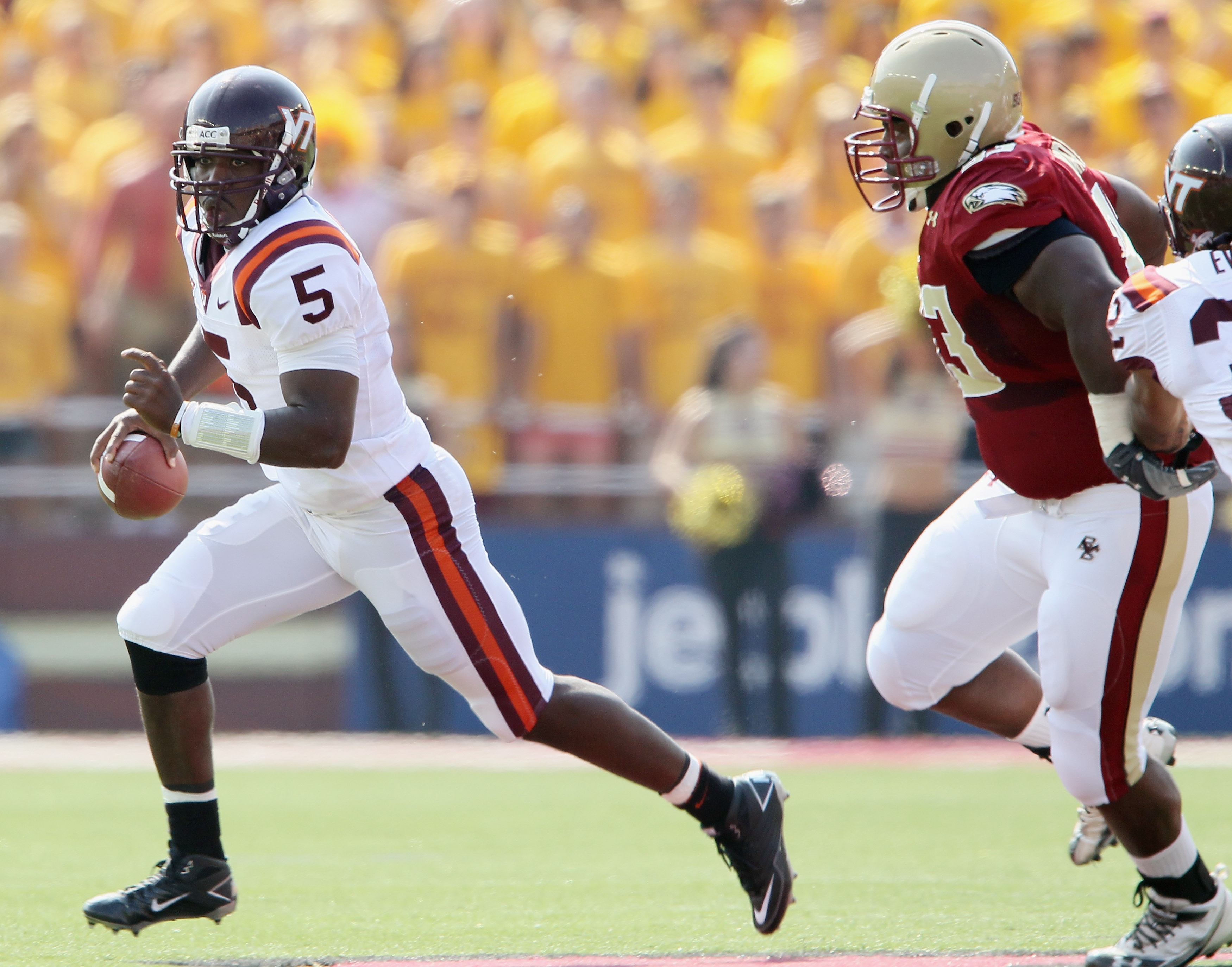 CHESTNUT HILL, MA - SEPTEMBER 25:  Tyrod Taylor #5 of the Virginia Tech Hokies scrambles with the ball as Bryan Murray #93  of the Boston College Eagles defends on September 25, 2010 at Alumni Stadium in Chestnut Hill, Massachusetts.  (Photo by Elsa/Getty