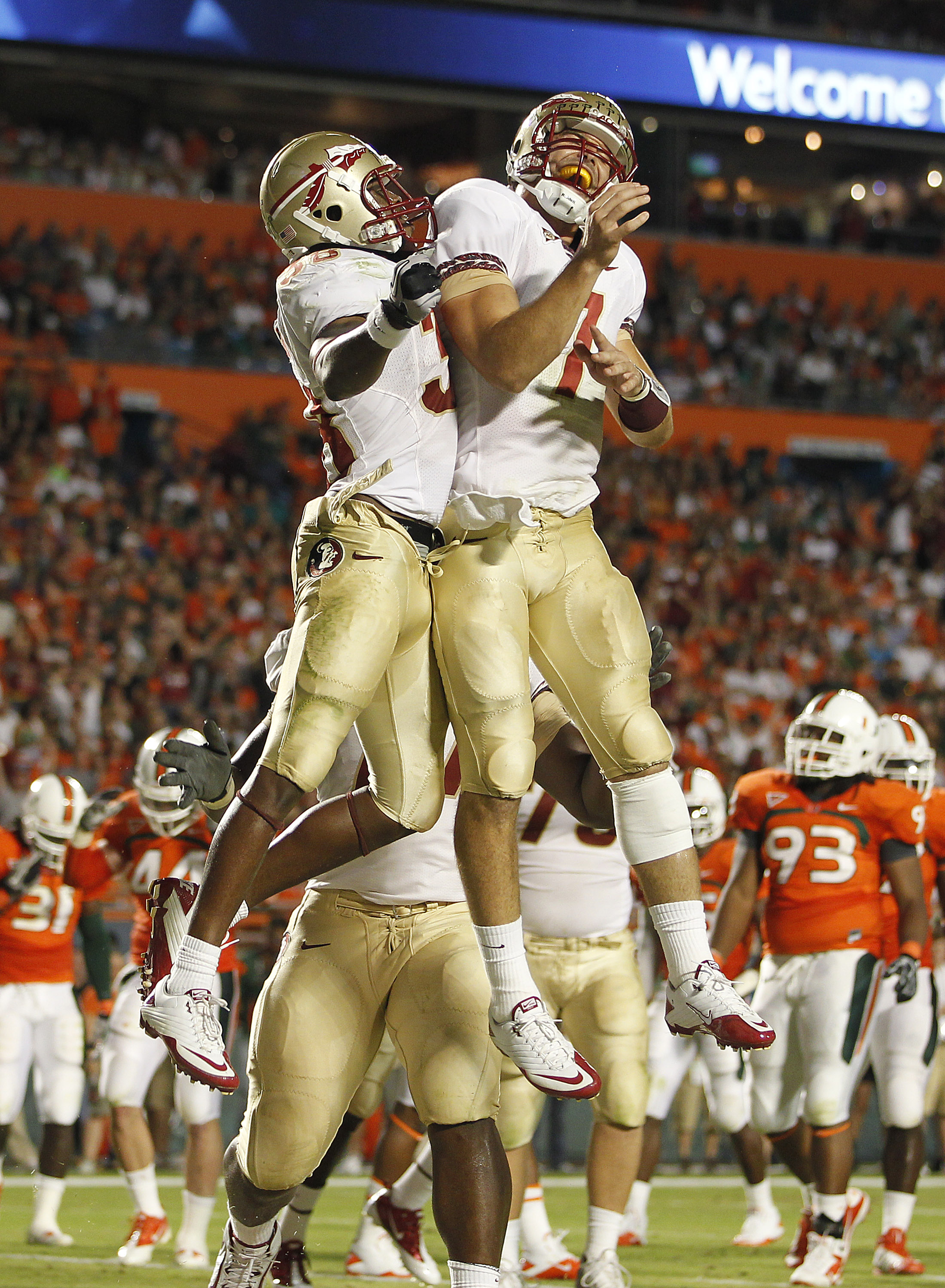 MIAMI, FL - OCTOBER 9: Jermaine Thomas #38 (L) celebrates his touchdown with Christian Ponder #7 (R) of the Florida State Seminoles against the Miami Hurricanes on October 9, 2010 at Sun Life Stadium in Miami, Florida. (Photo by Joel Auerbach/Getty Images