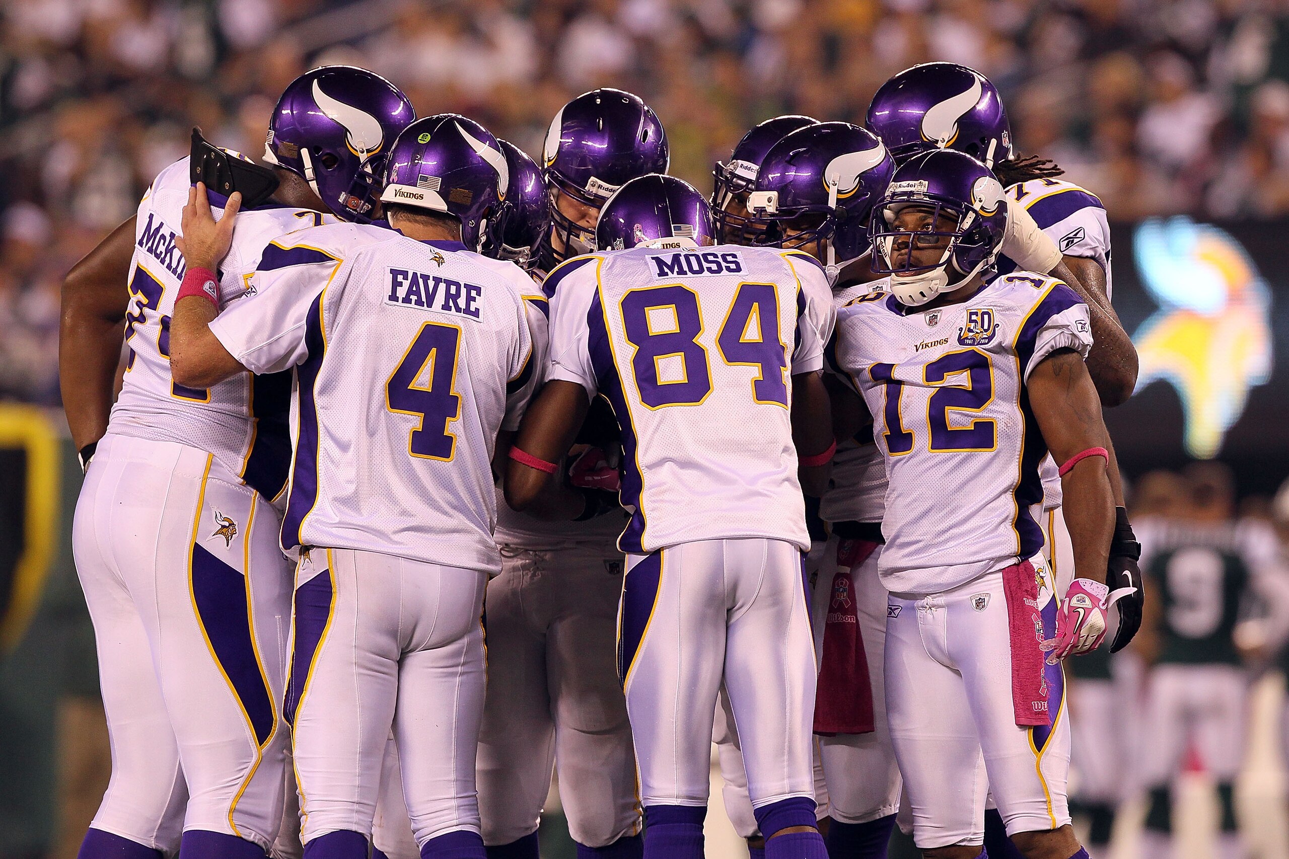 EAST RUTHERFORD, NJ - OCTOBER 11: (L-R) Brett Favre #4, Randy Moss #84 and Percy Harvin #12 of  the Minnesota Vikings huddle up on offense against the New York Jets at New Meadowlands Stadium on October 11, 2010 in East Rutherford, New Jersey.  (Photo by 