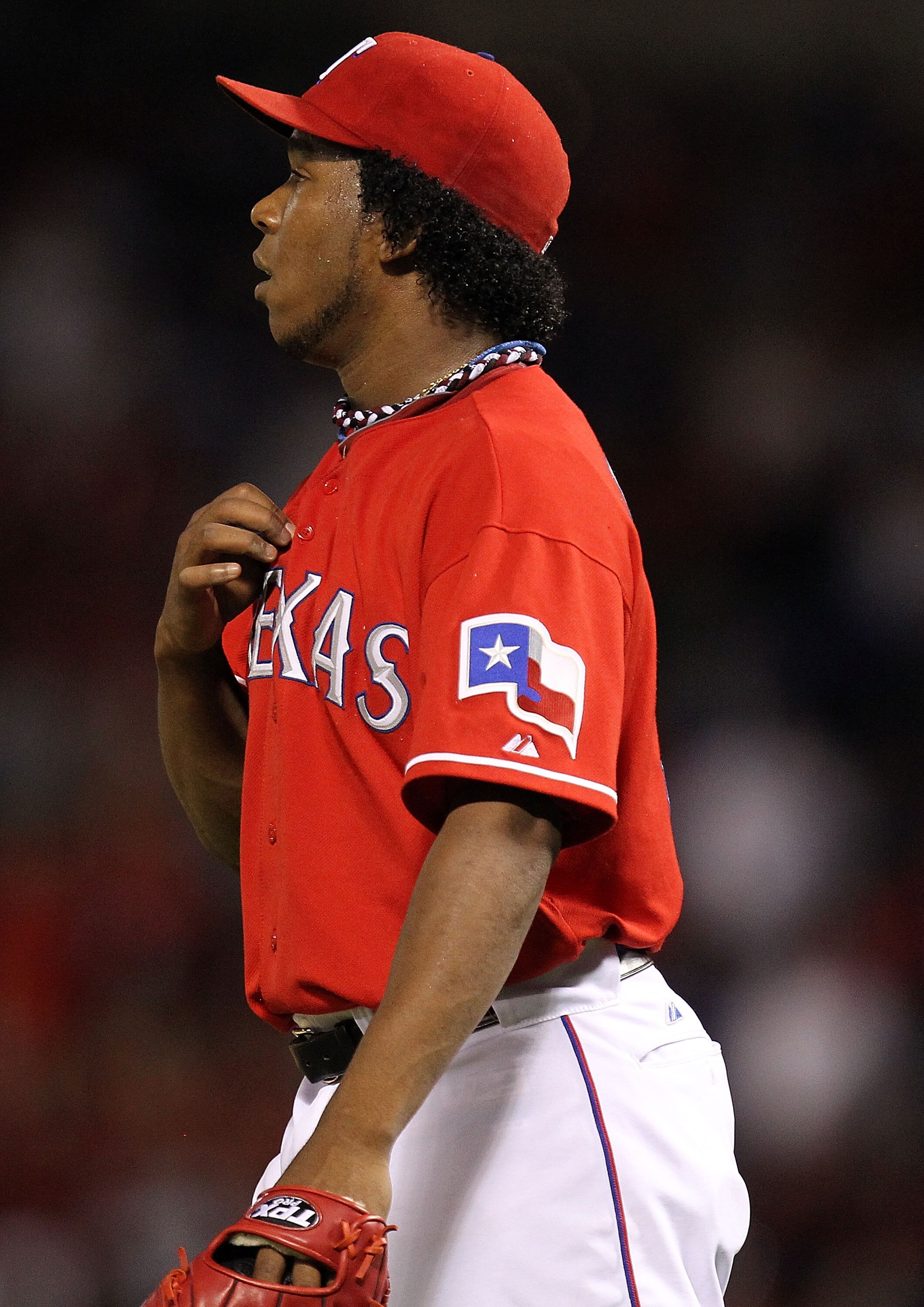 ARLINGTON, TX - OCTOBER 09:  Pitcher Neftali Feliz #30 of the Texas Rangers reacts after giving up a homerun to Carl Crawford #13 of the Tampa Bay Rays in the 9th inning during game 3 of the ALDS at Rangers Ballpark in Arlington on October 9, 2010 in Arli