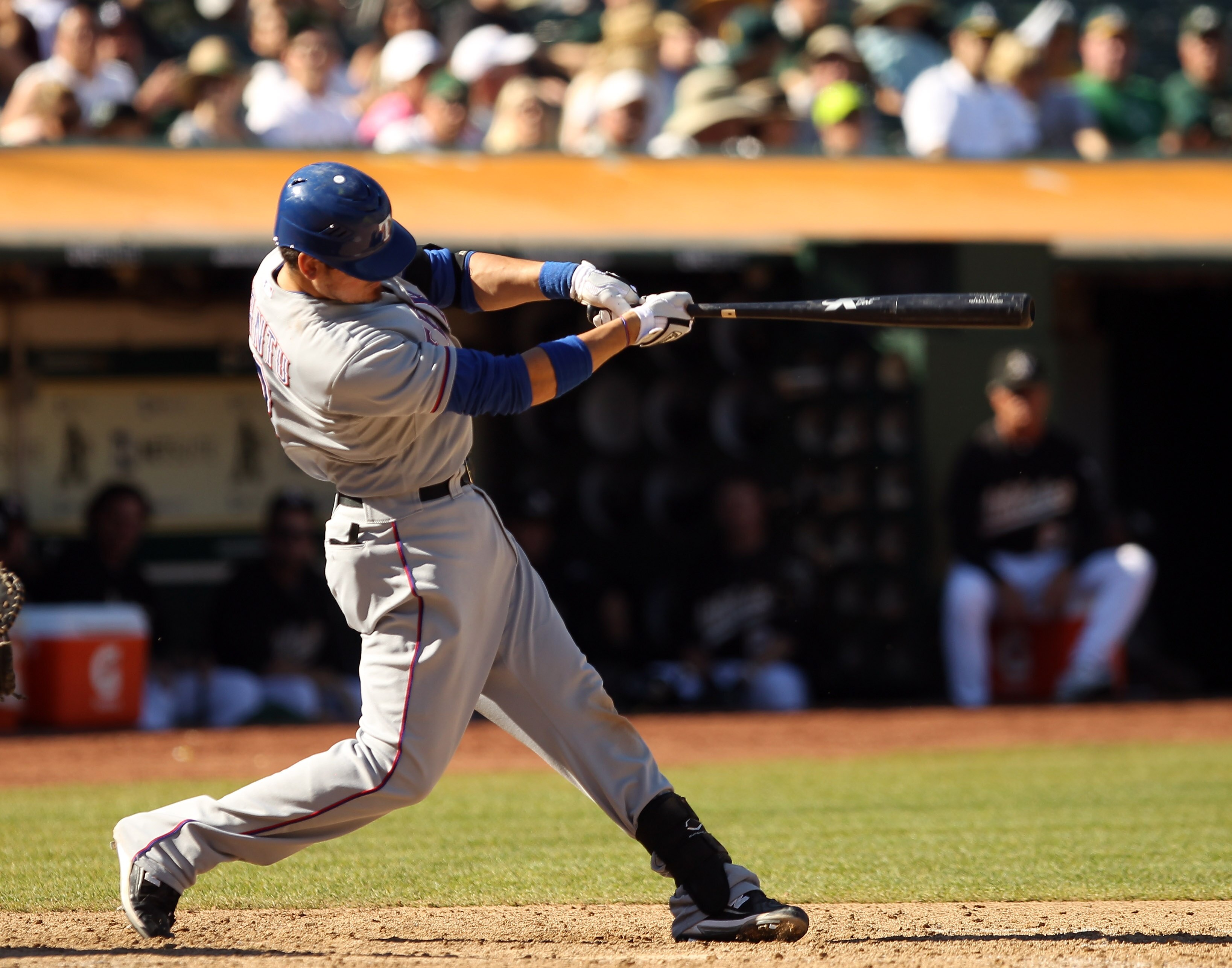 OAKLAND, CA - SEPTEMBER 25:  Jorge Cantu #8 of the Texas Rangers hits the game winning home run against the Oakland Athletics at the Oakland-Alameda County Coliseum on September 25, 2010 in Oakland, California. The Rangers clinched the American League Wes