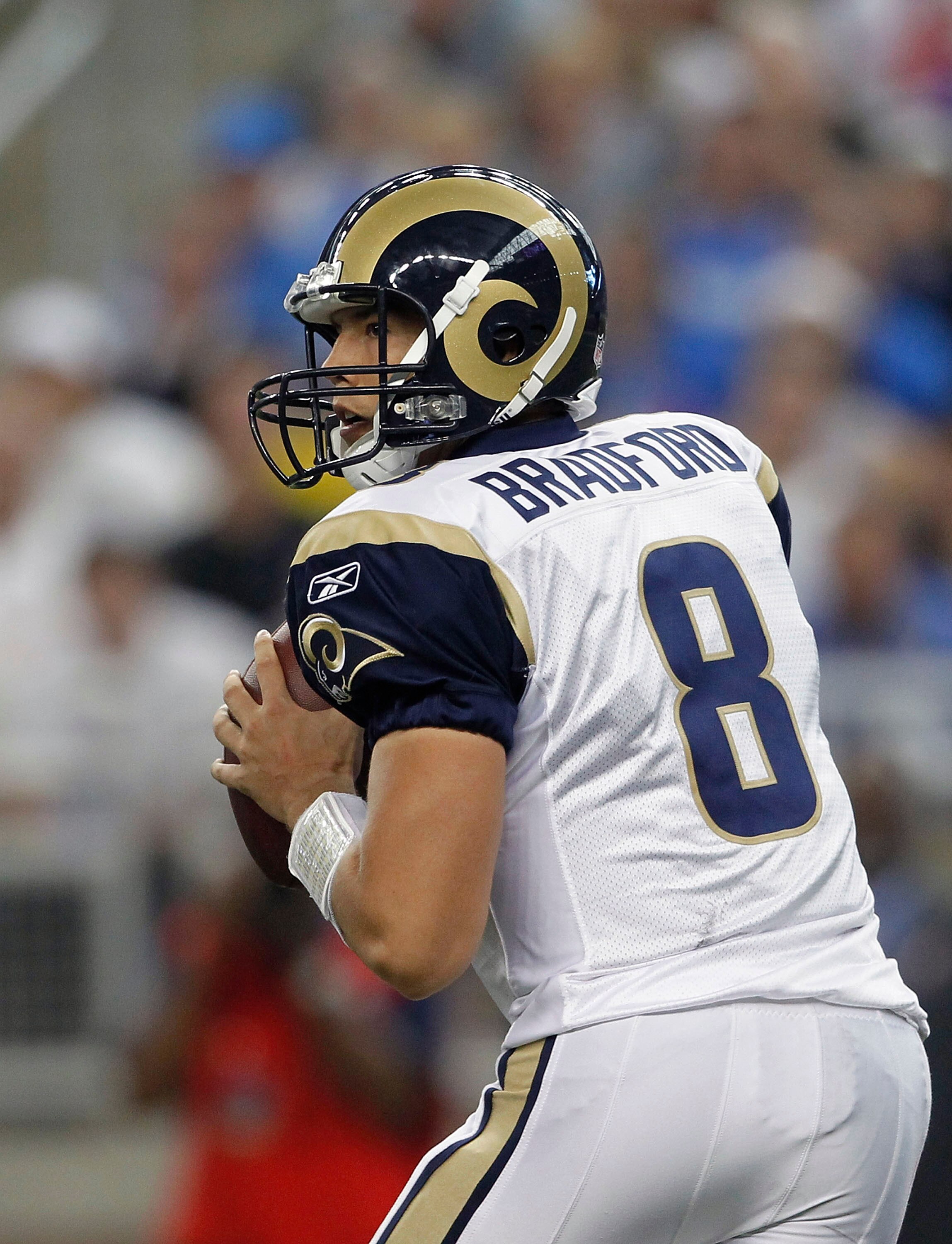 DETROIT - OCTOBER 10:  Sam Bradford #8 of the St. Louis Rams drops back to pass during the fourth quarter during the game against the Detroit Lions at Ford Field on October 10, 2010 in Detroit, Michigan. The Lions defeated the Rams 44-6.  (Photo by Leon H