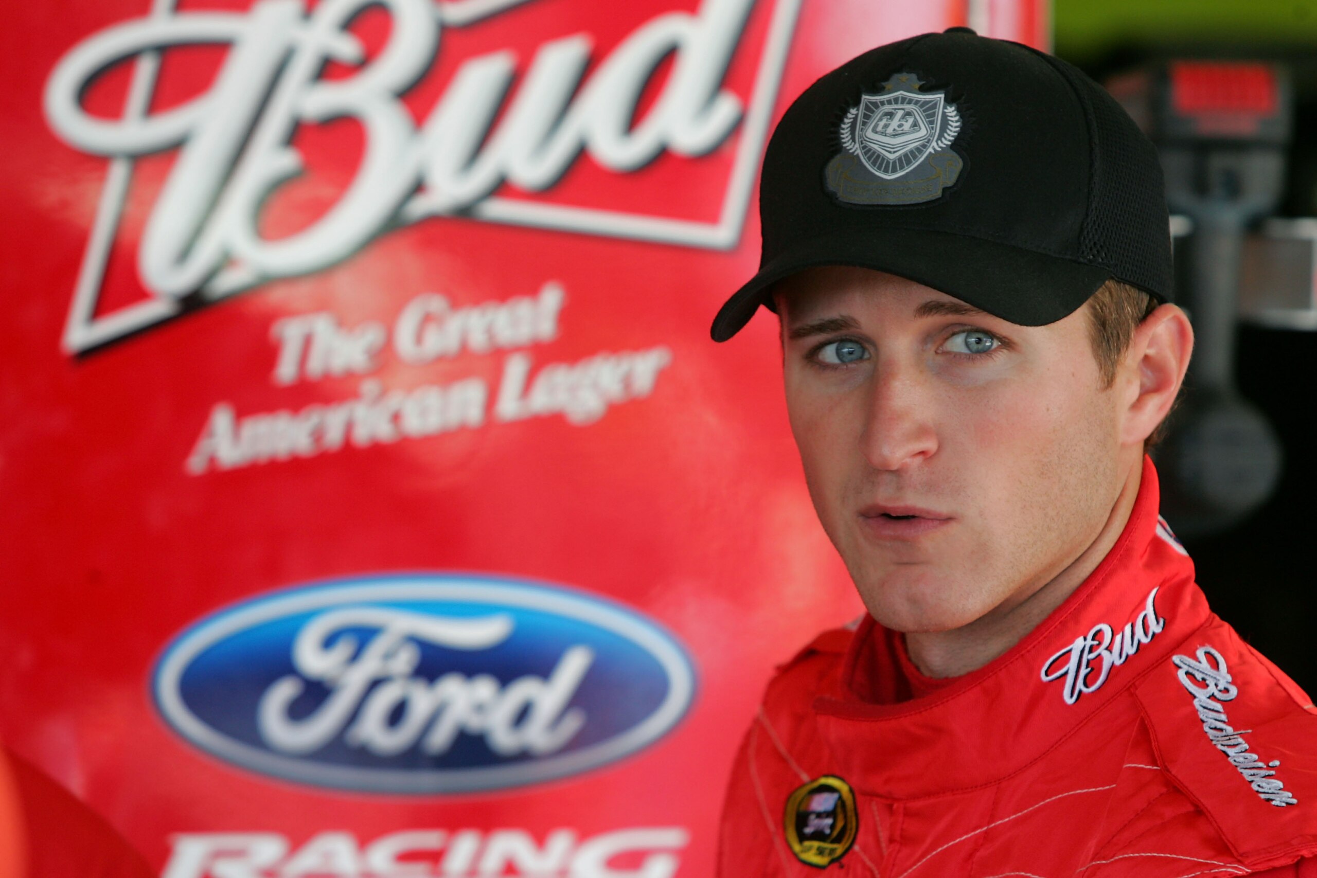 KANSAS CITY, KS - OCTOBER 01:  Kasey Kahne, driver of the #9 Budweiser Ford, stands in the garage during practice for the NASCAR Sprint Cup Series Price Chopper 400 on October 1, 2010 in Kansas City, Kansas.  (Photo by Jerry Markland/Getty Images for NASC