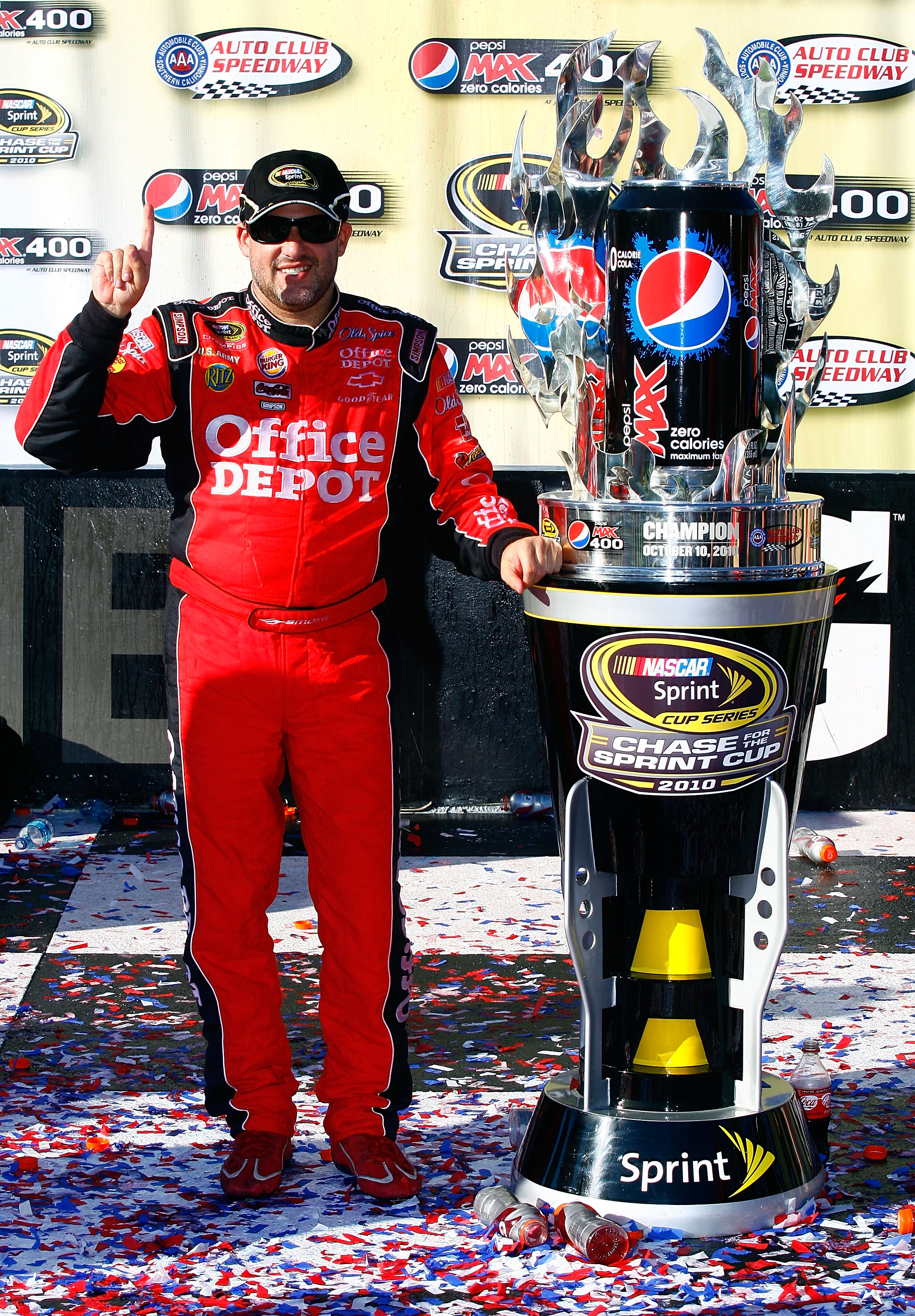 FONTANA, CA - OCTOBER 10:  Tony Stewart, driver of the #14 Office Depot Chevrolet, celebrates in victory lane after winning the NASCAR Sprint Cup Series Pepsi Max 400 on October 10, 2010 in Fontana, California.  (Photo by Jason Smith/Getty Images for NASC