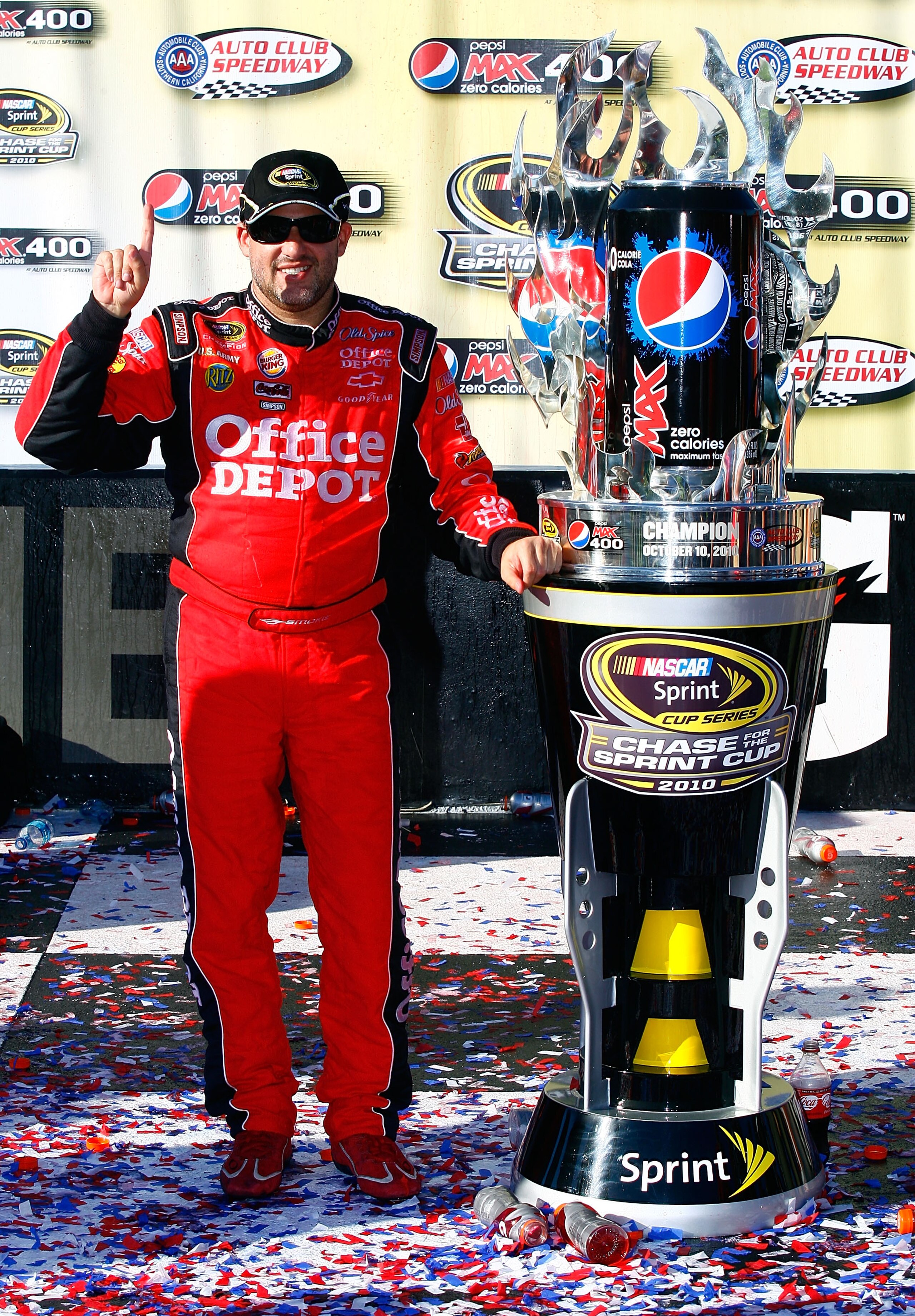 FONTANA, CA - OCTOBER 10:  Tony Stewart, driver of the #14 Office Depot Chevrolet, celebrates in victory lane after winning the NASCAR Sprint Cup Series Pepsi Max 400 on October 10, 2010 in Fontana, California.  (Photo by Jason Smith/Getty Images for NASC