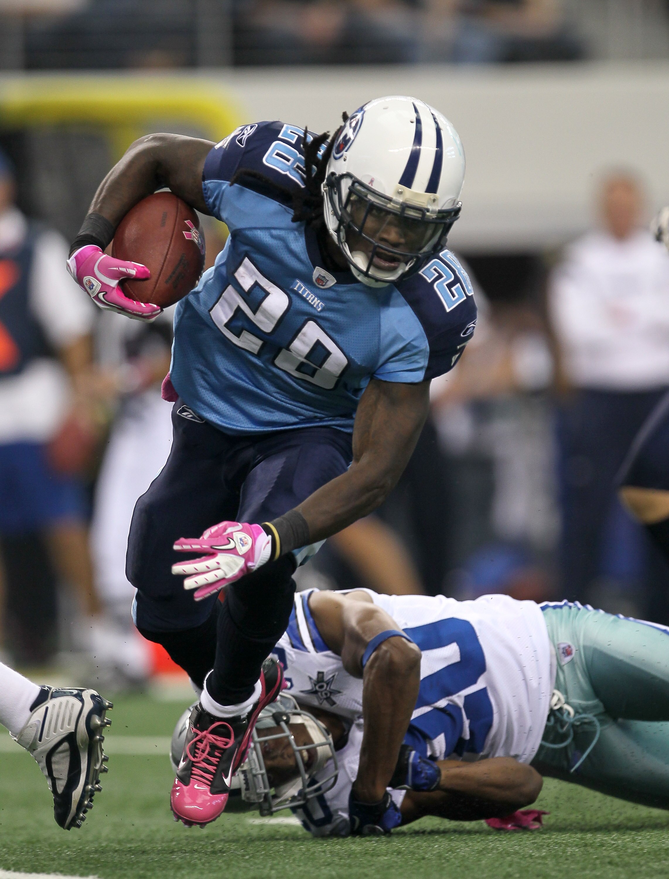 ARLINGTON, TX - OCTOBER 10:  Running back Chris Johnson #28 of the Tennessee Titans carries the ball against the Dallas Cowboys at Cowboys Stadium on October 10, 2010 in Arlington, Texas.   The Titans won 34-27.  (Photo by Stephen Dunn/Getty Images)